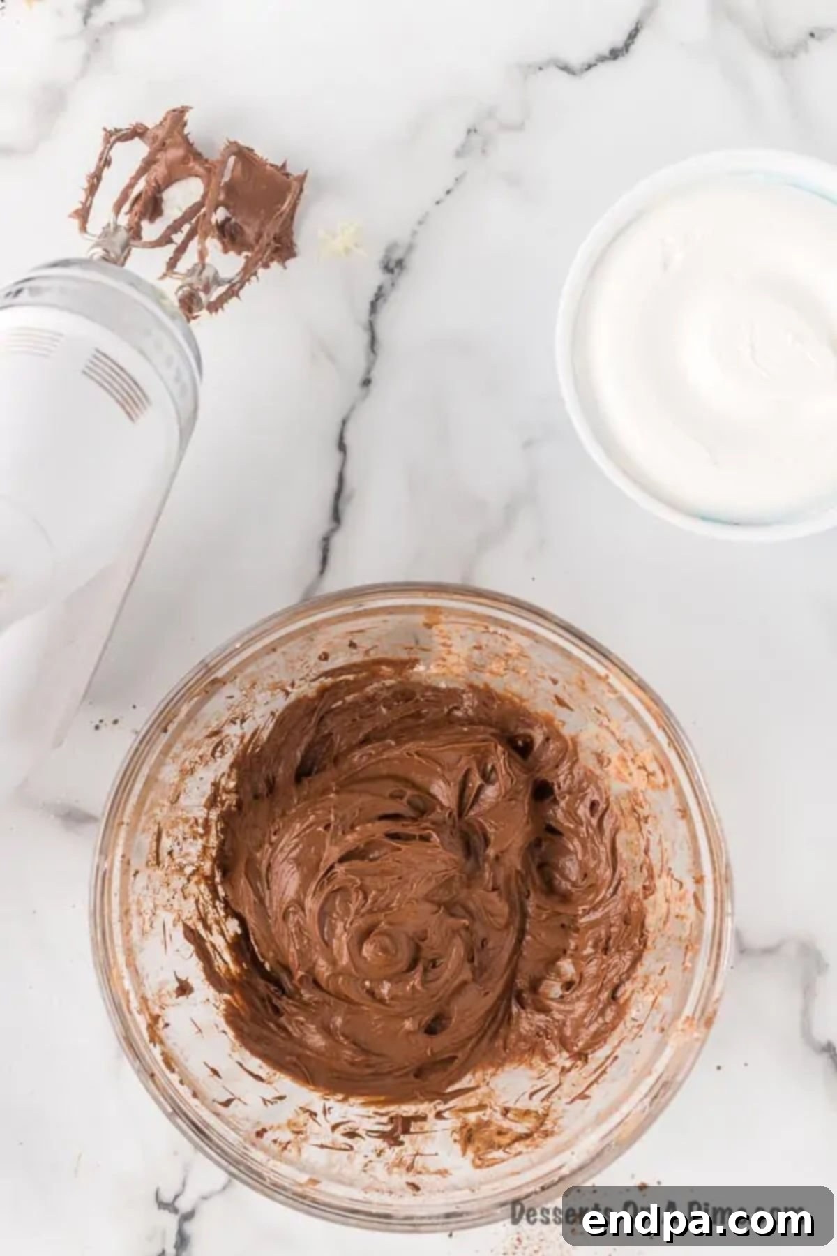 Sweet Chocolate Fruit Indulgence 5 Cocoa powder and vanilla extract being added to the cream cheese mixture.