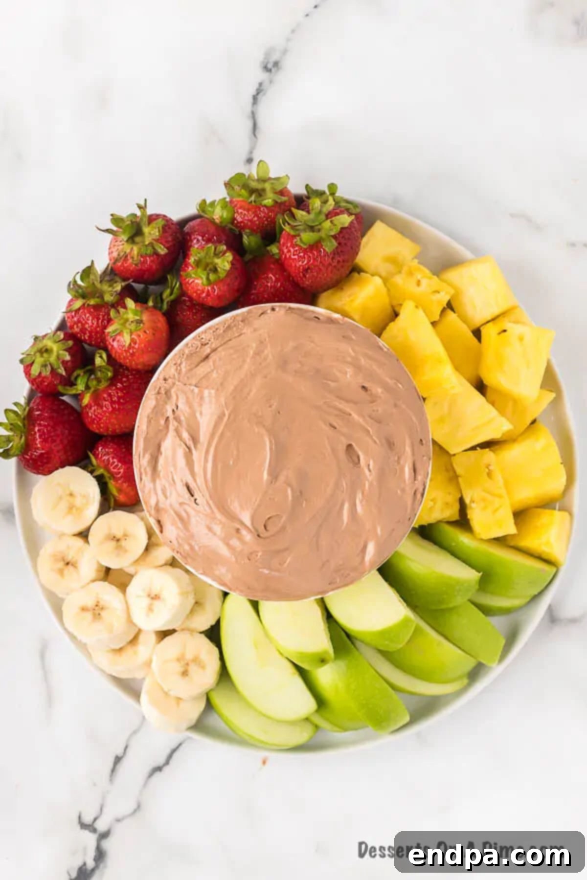 Sweet Chocolate Fruit Indulgence 7 A fruit platter featuring the chocolate dip surrounded by various fresh fruits.