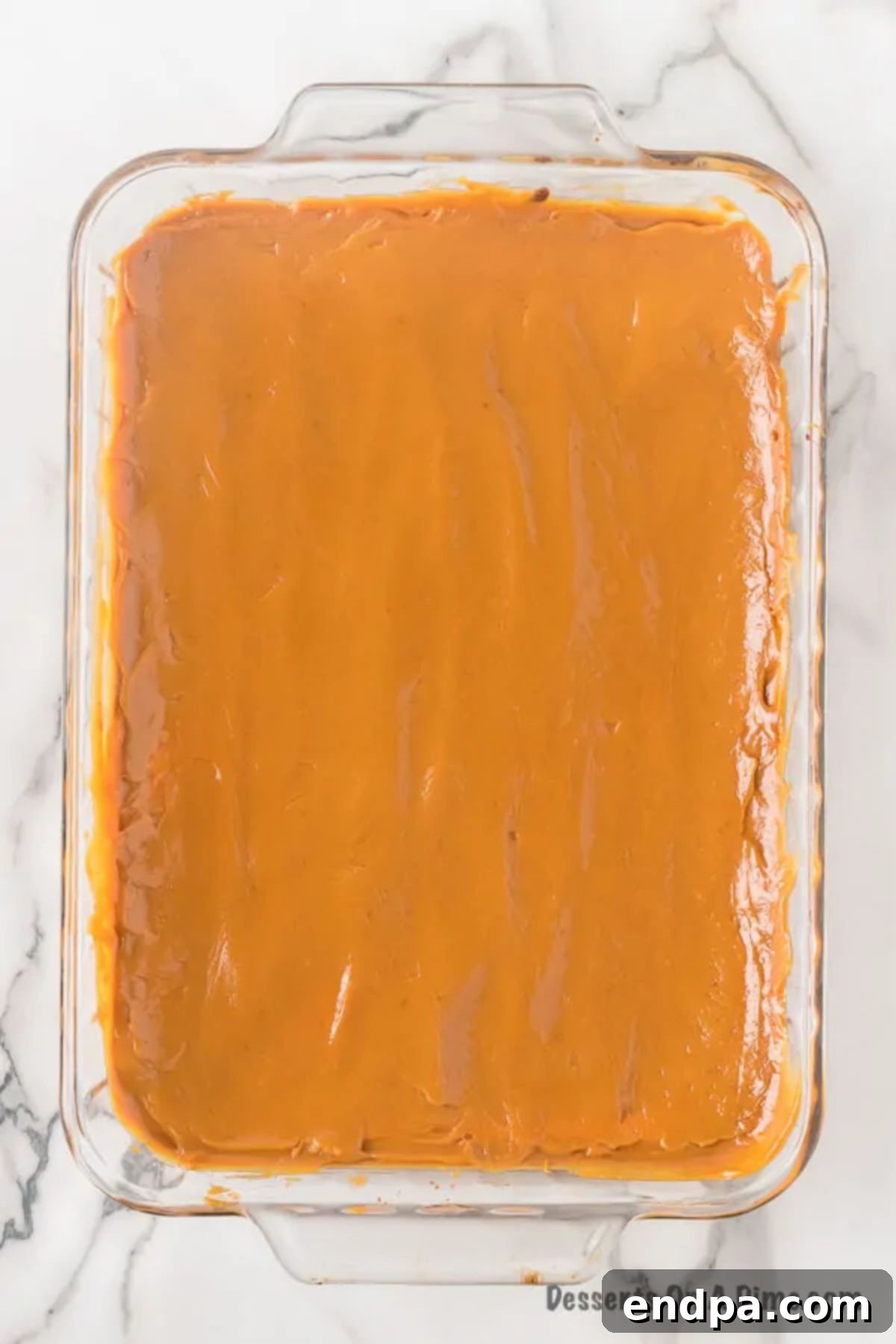 Baking dish with caramel on top cooling. 