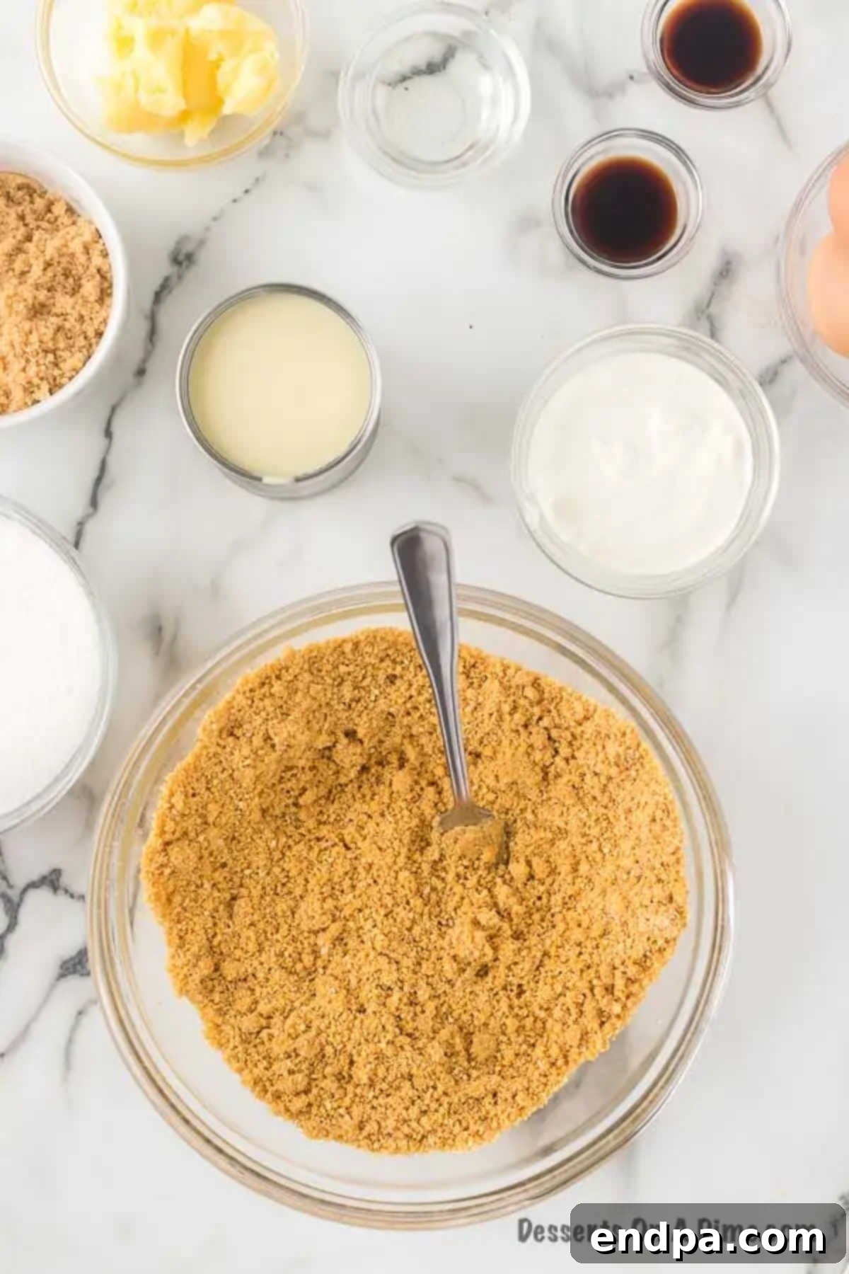 Bowl of graham cracker crumbs with butter. 