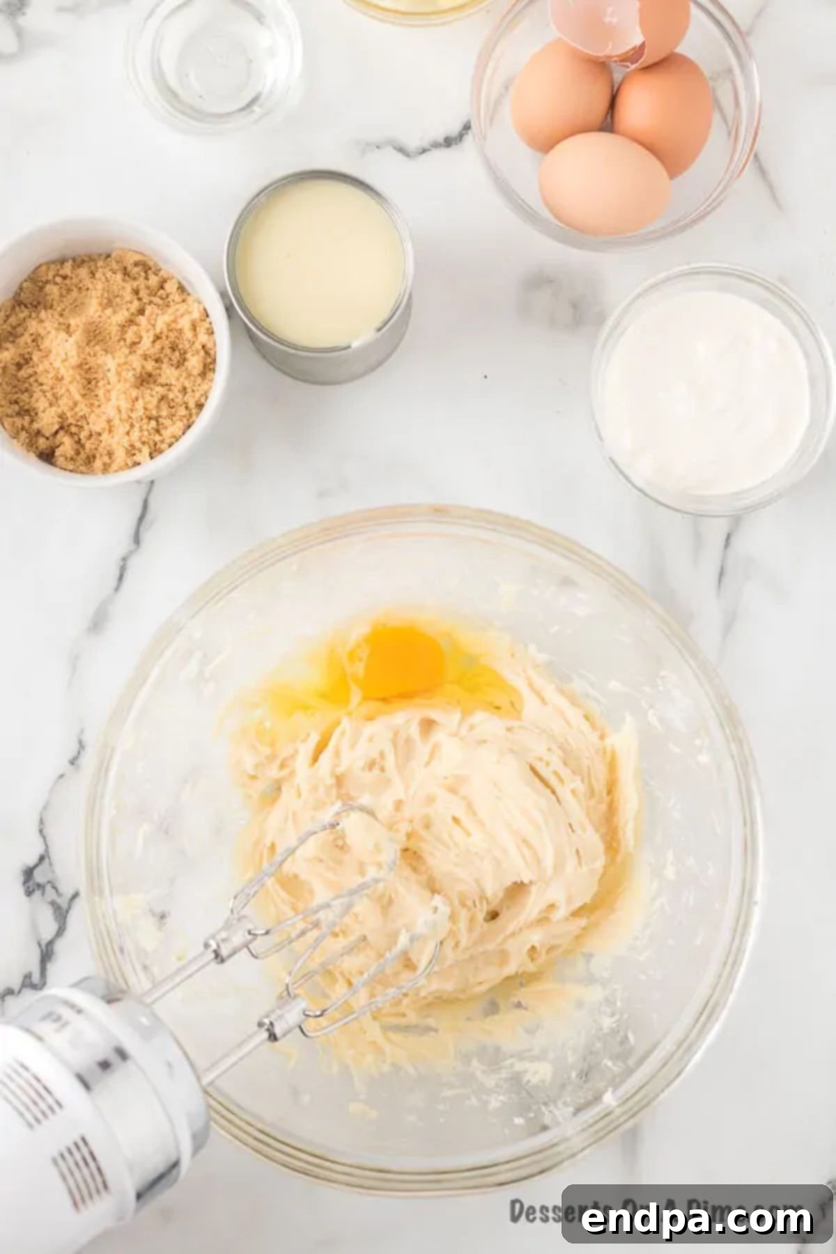 Eggs added to the mixing bowl. 
