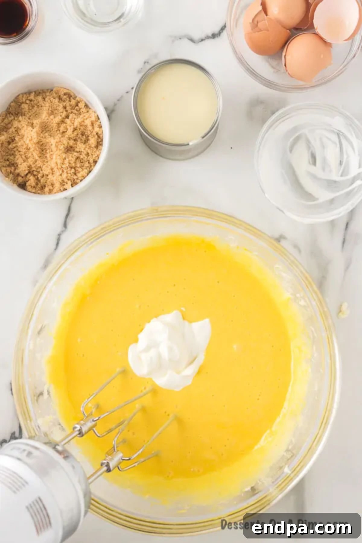 Sour Cream mixed into bowl of batter. 
