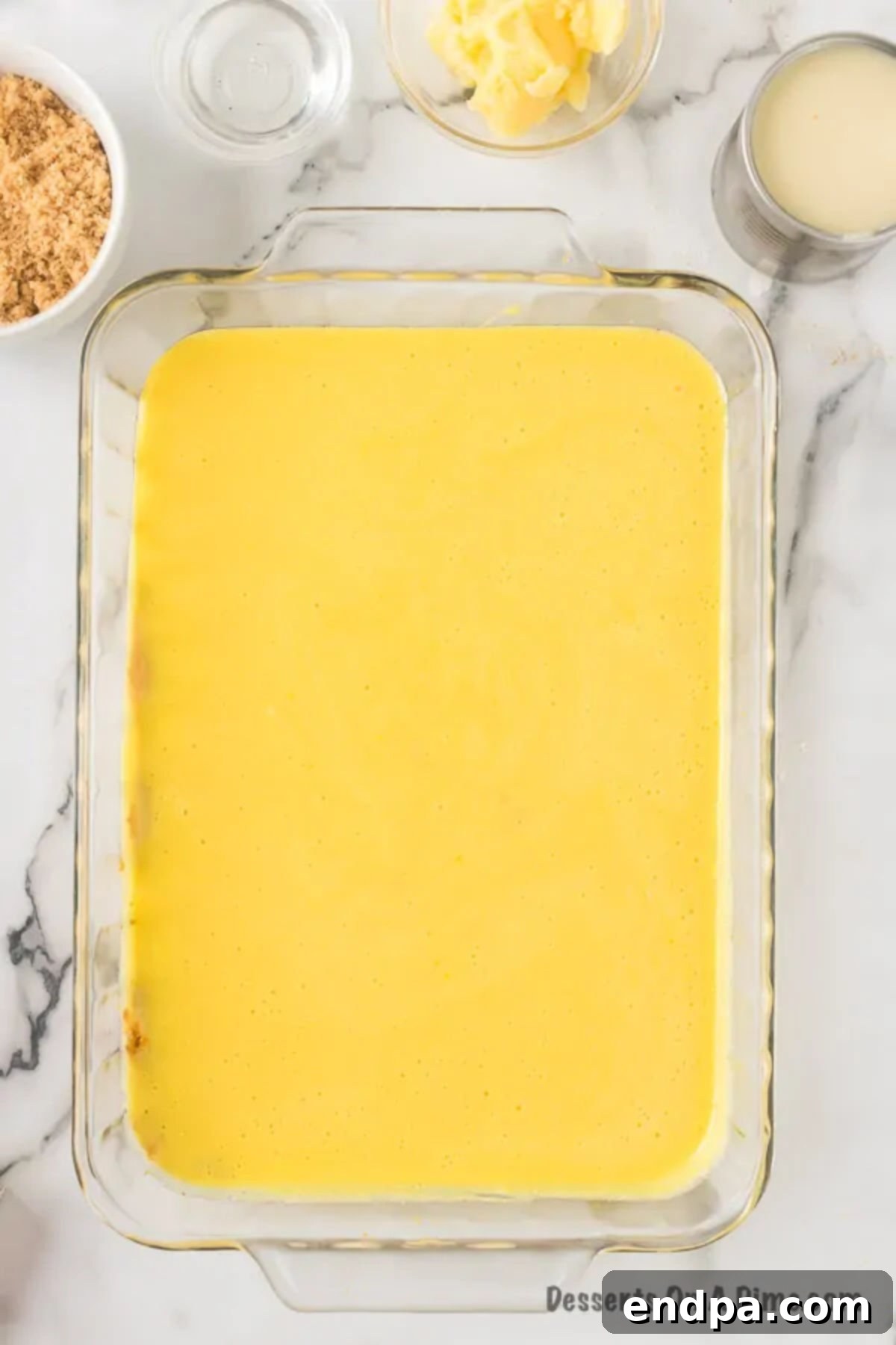 Cheesecake batter poured into pan. 