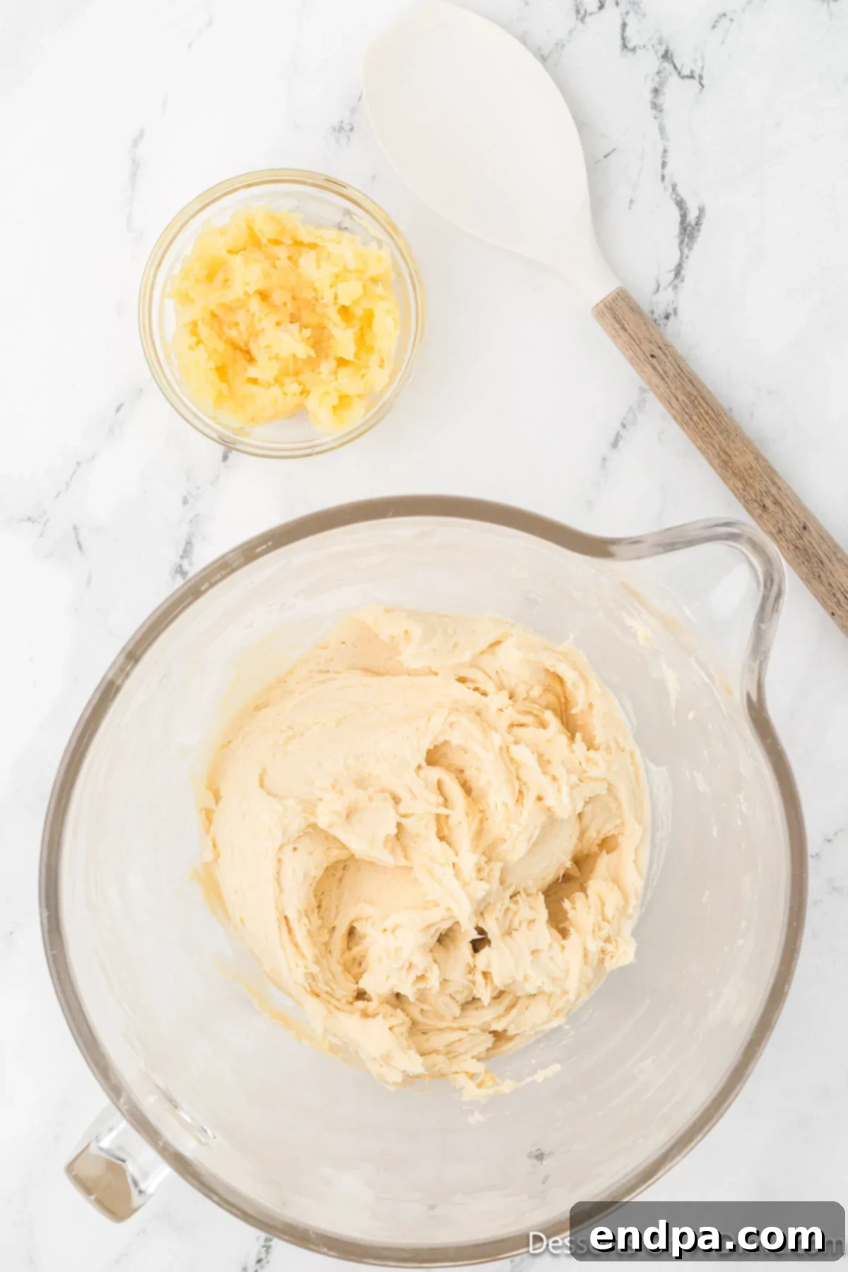 The dry and wet ingredients are carefully combined, followed by the addition of thoroughly drained crushed pineapple, before chilling.