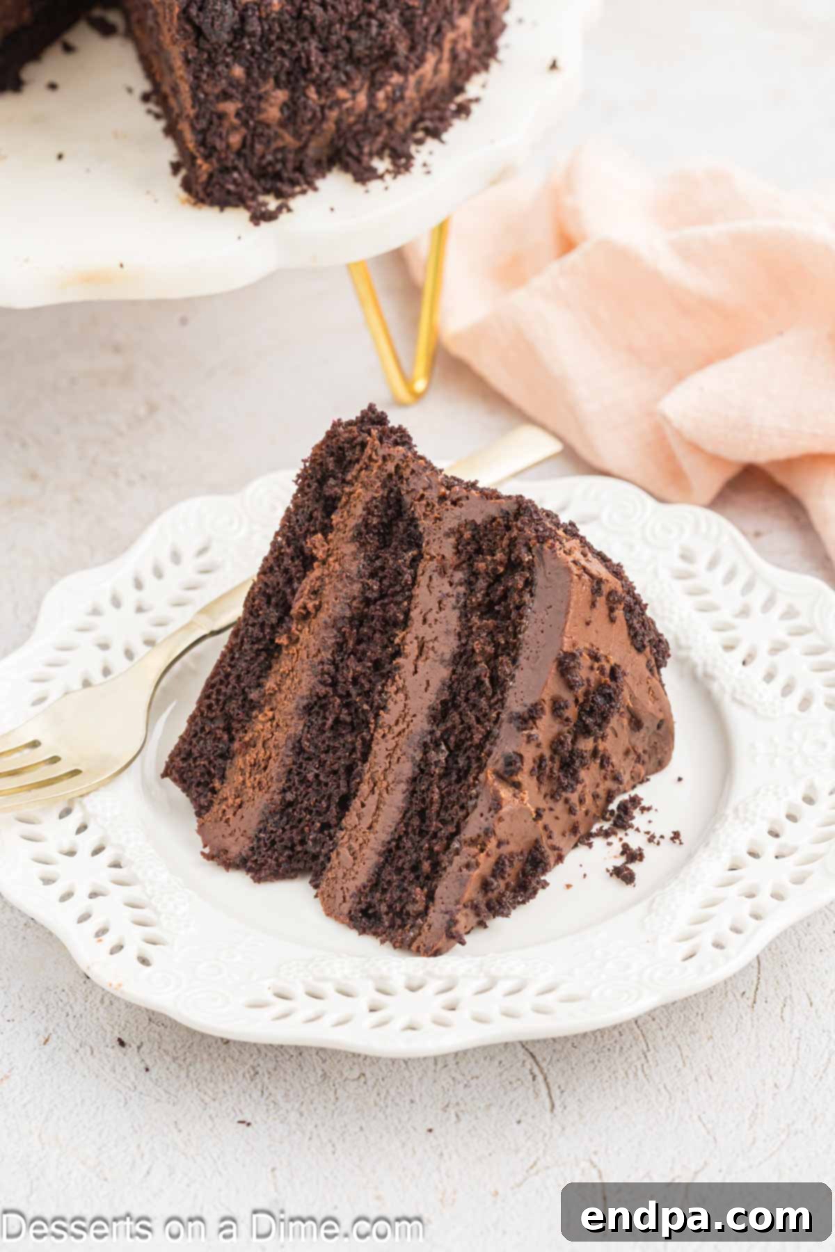 Ultimate Dark Chocolate Decadence 2 A perfectly sliced piece of Blackout Cake presented on a white plate, showcasing its dark, moist layers and rich frosting.