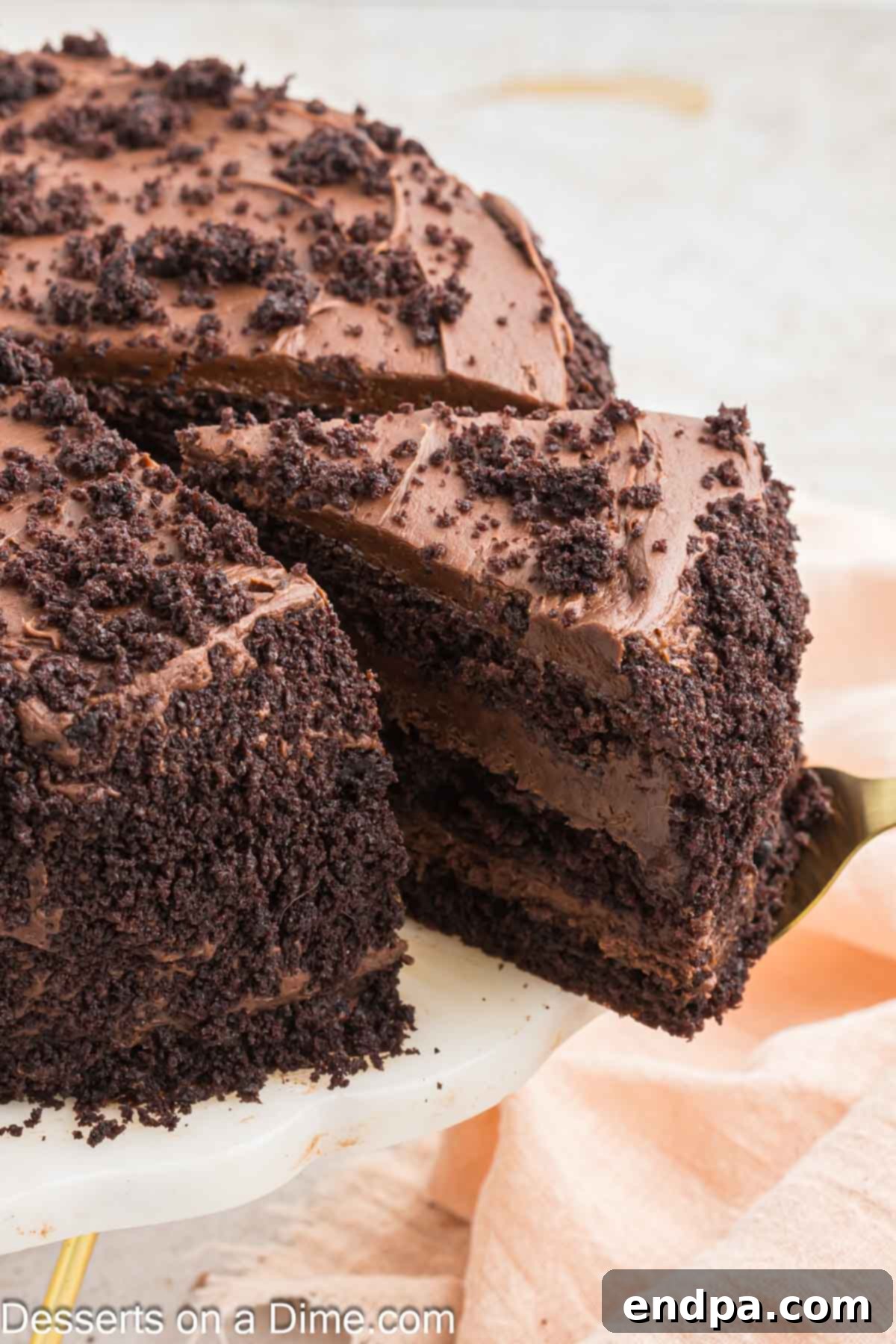 Ultimate Dark Chocolate Decadence 12 A hand slicing into a beautifully prepared Blackout Cake, revealing its rich, moist layers and creamy frosting.