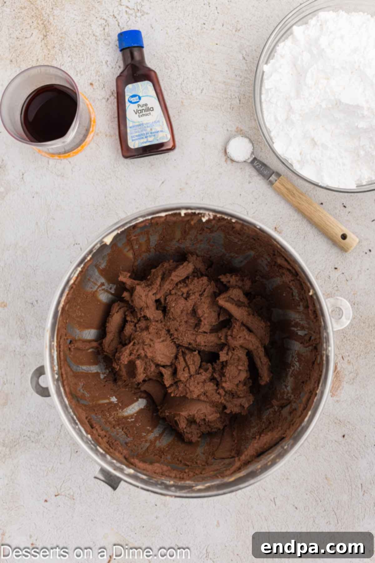 Ultimate Dark Chocolate Decadence 9 Unsweetened cocoa powder is added to the butter and cream cheese mixture, followed by vanilla extract and powdered sugar for the frosting.