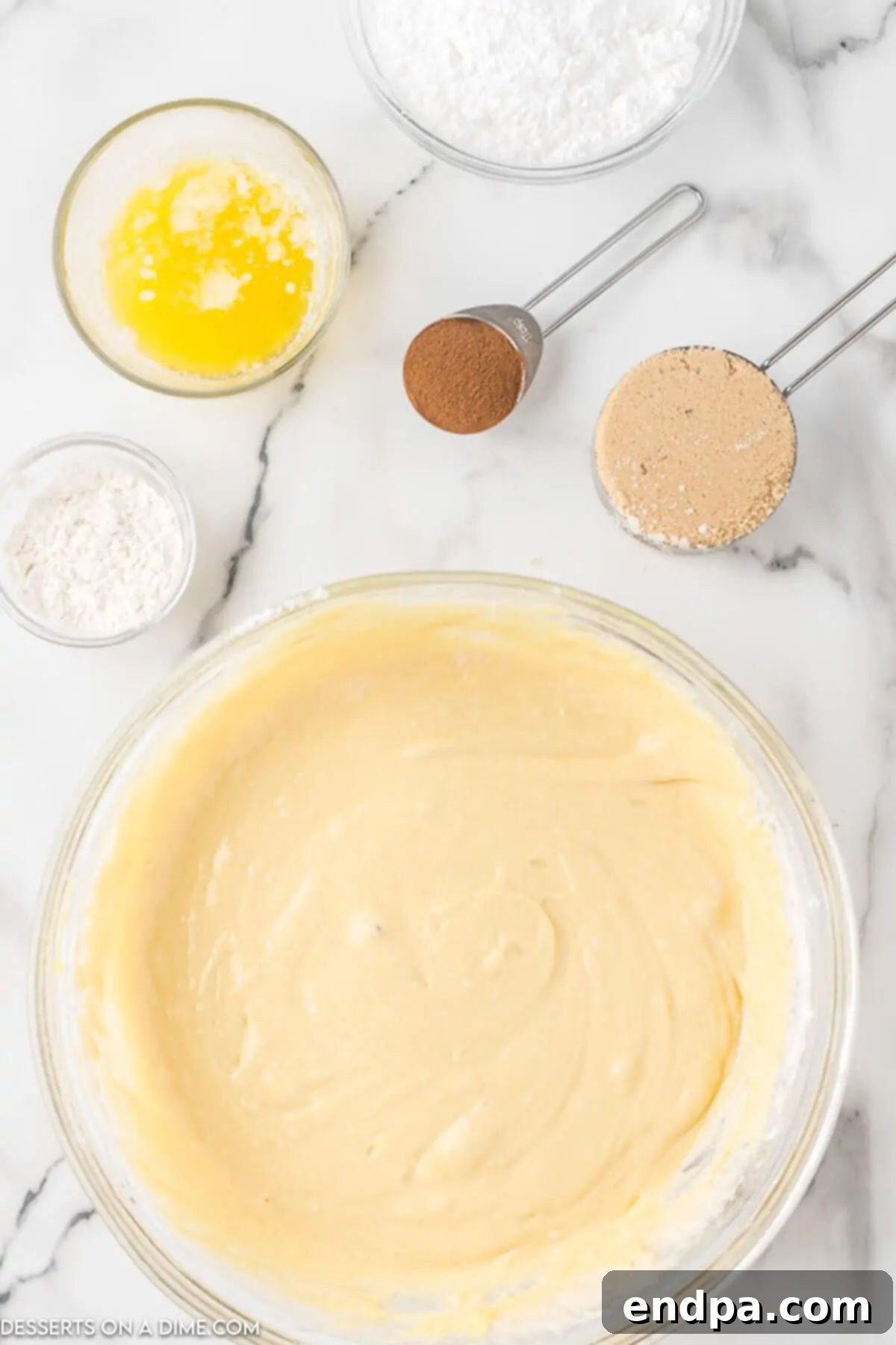 Indulgent Cinnamon Roll Cake Delight 3 Combining the cake ingredients in a bowl