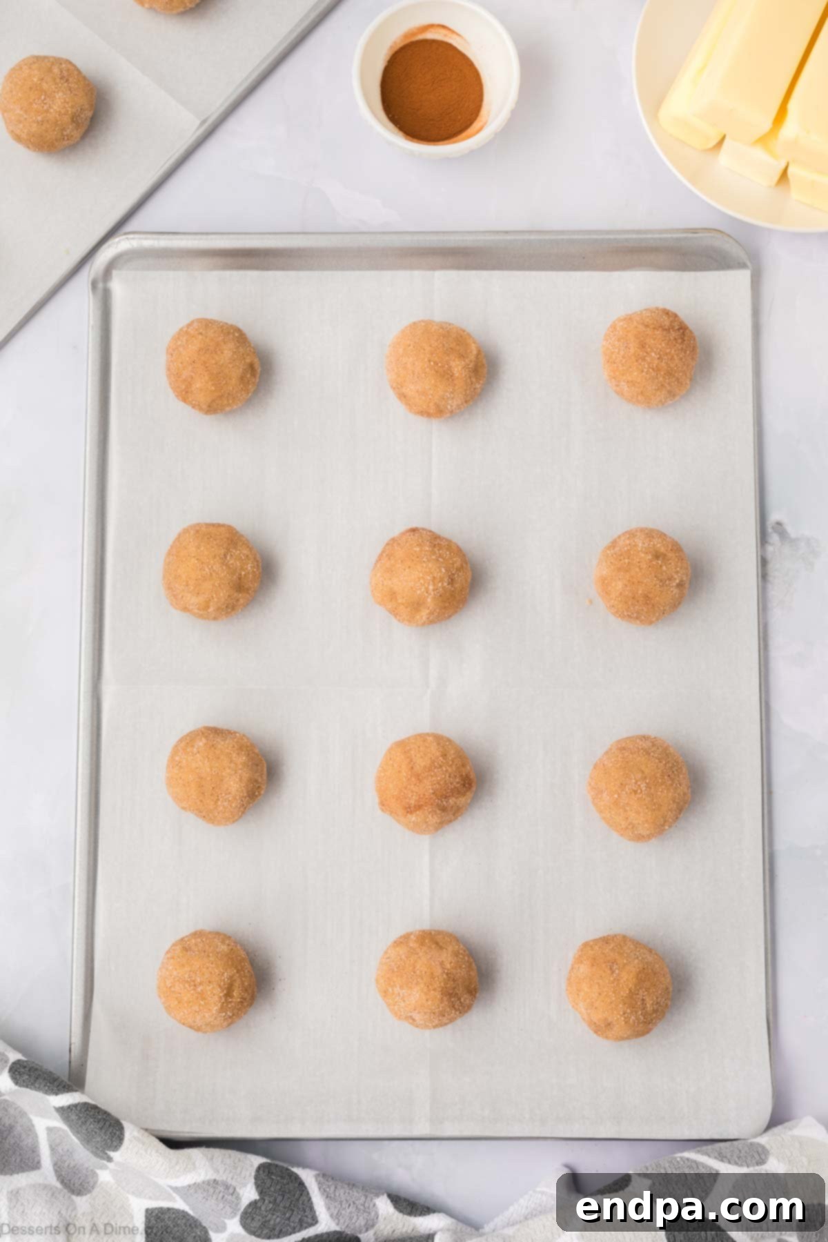 Spanish Cinnamon Sugar Cookies 11 Cookie dough balls on baking sheet.