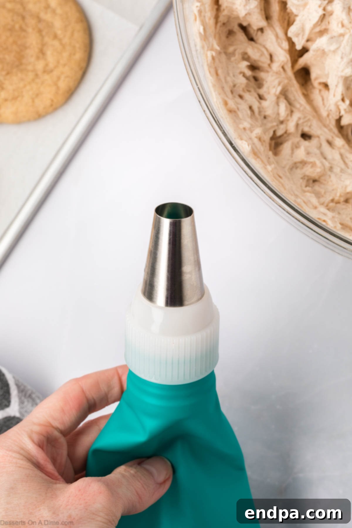 Spanish Cinnamon Sugar Cookies 16 Frosting in a piping bag.