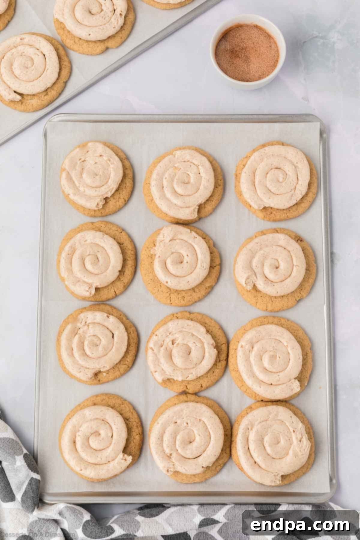Spanish Cinnamon Sugar Cookies 17 Frosting piped on to the cookies.