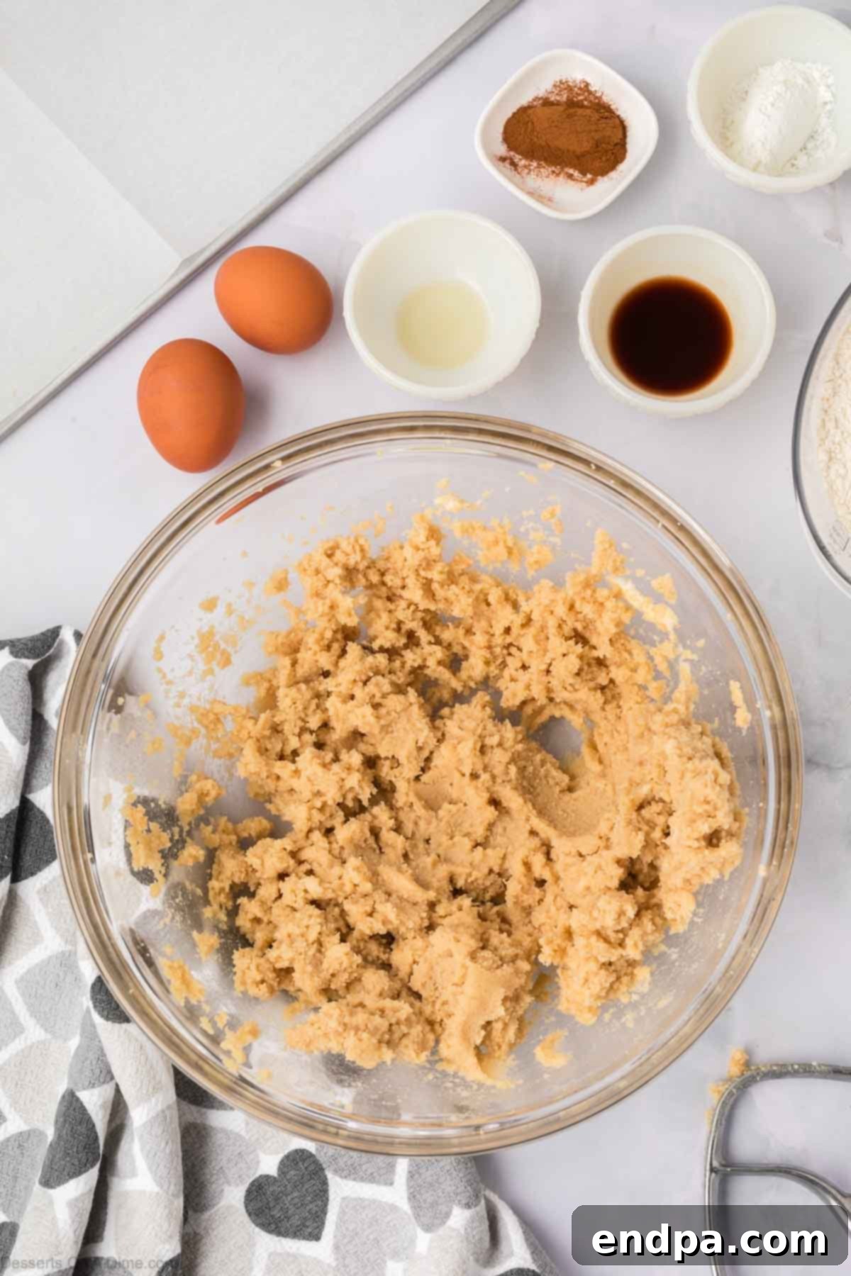 Spanish Cinnamon Sugar Cookies 6 Sugar and butter combined in a mixing bowl.