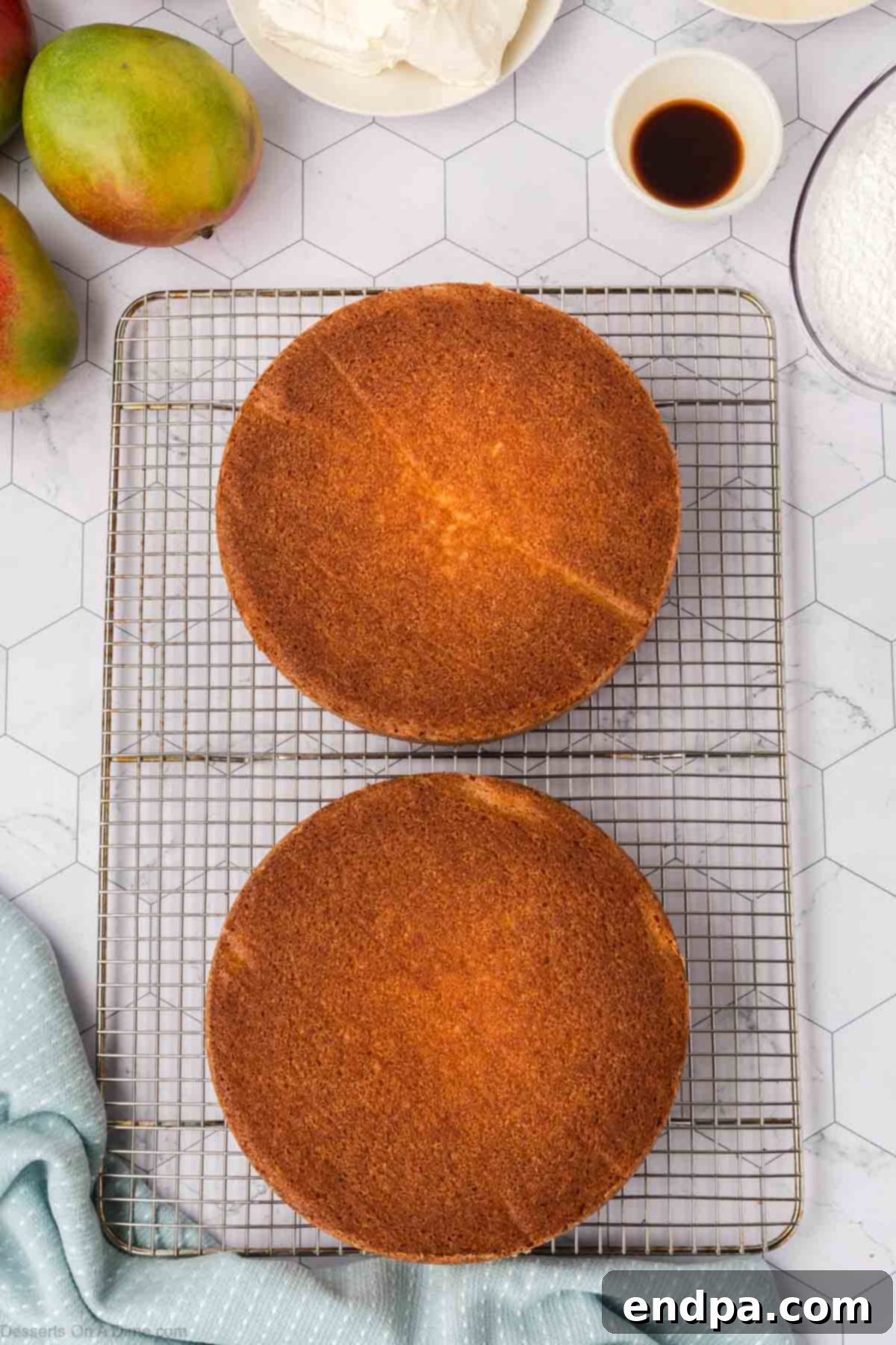 Baked cake layers removed from pans and cooling completely on a wire rack to prevent sogginess.