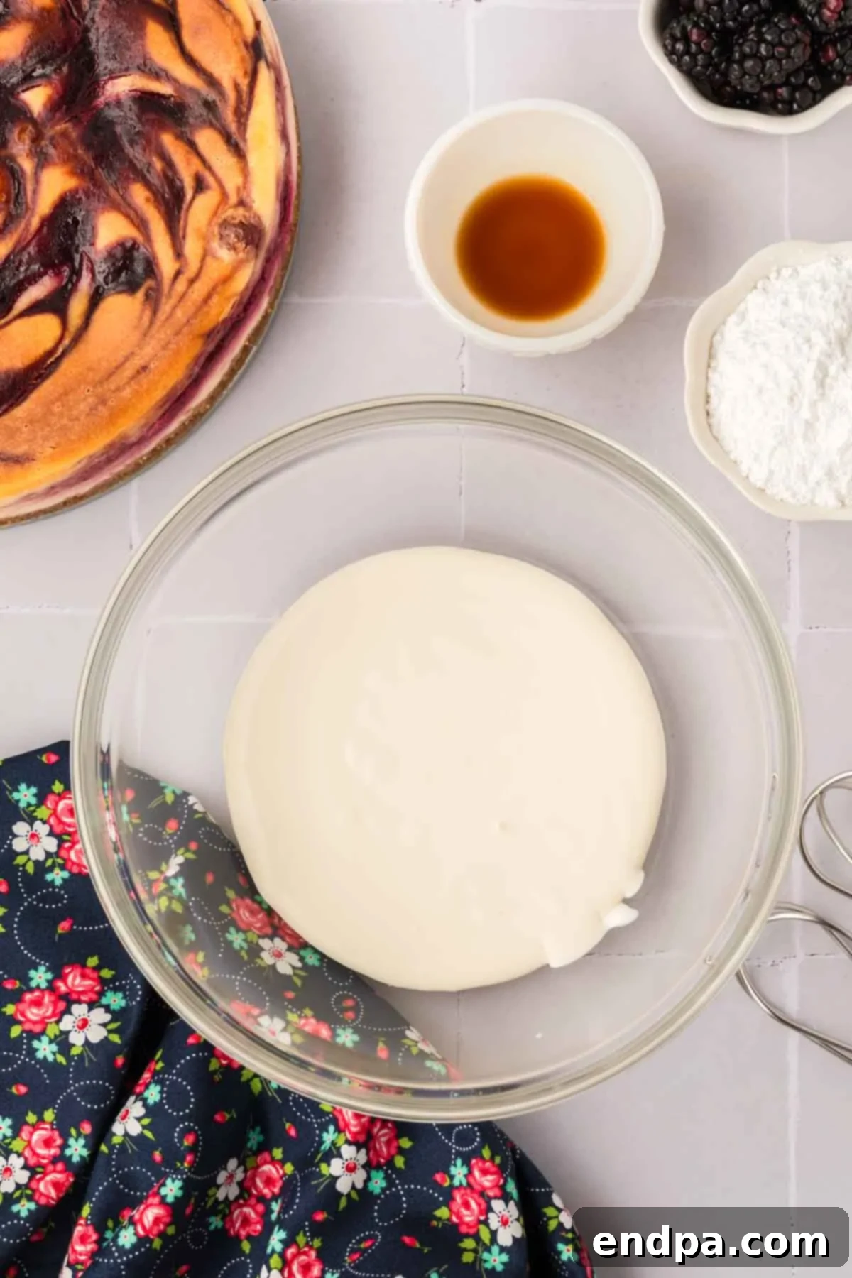 Cold heavy cream in a mixing bowl, ready to be whipped into cream.