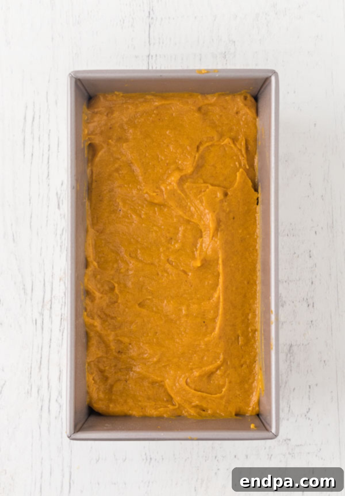 Pour the batter into a loaf pan.