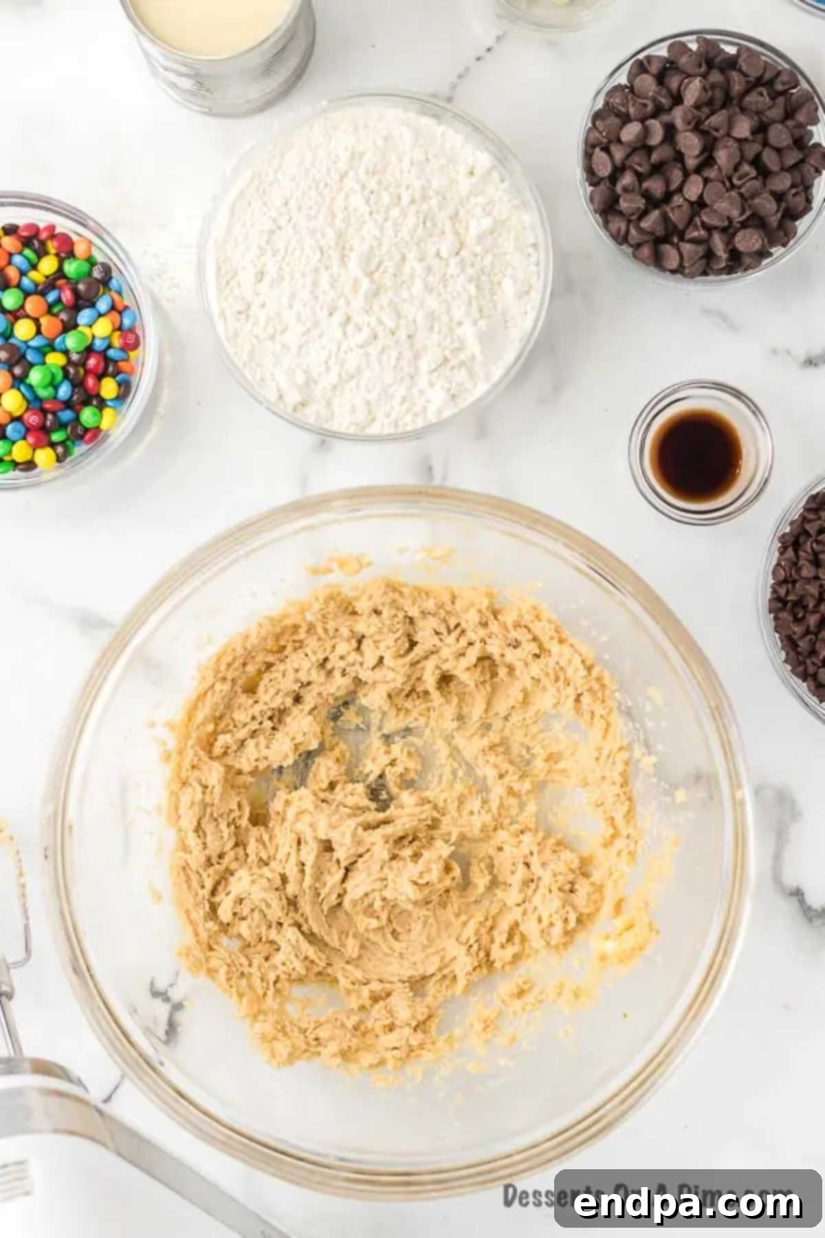 Mixing bowl with softened butter and brown sugar, ready to be creamed.