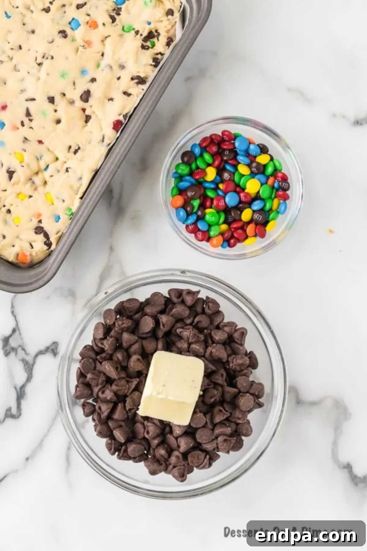 A microwave-safe bowl filled with chocolate chips and butter, ready for melting.