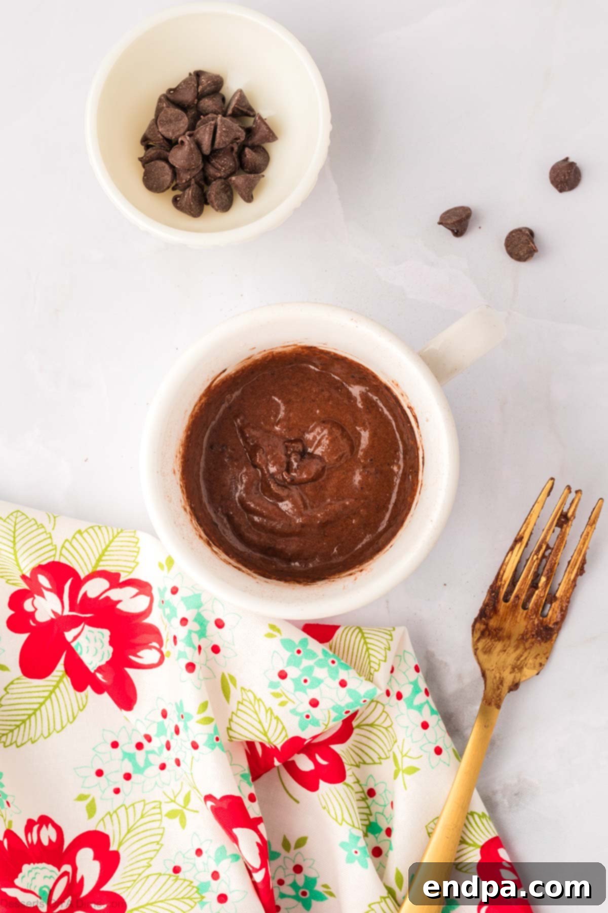 Mug with wet and dry ingredients mixed together. 