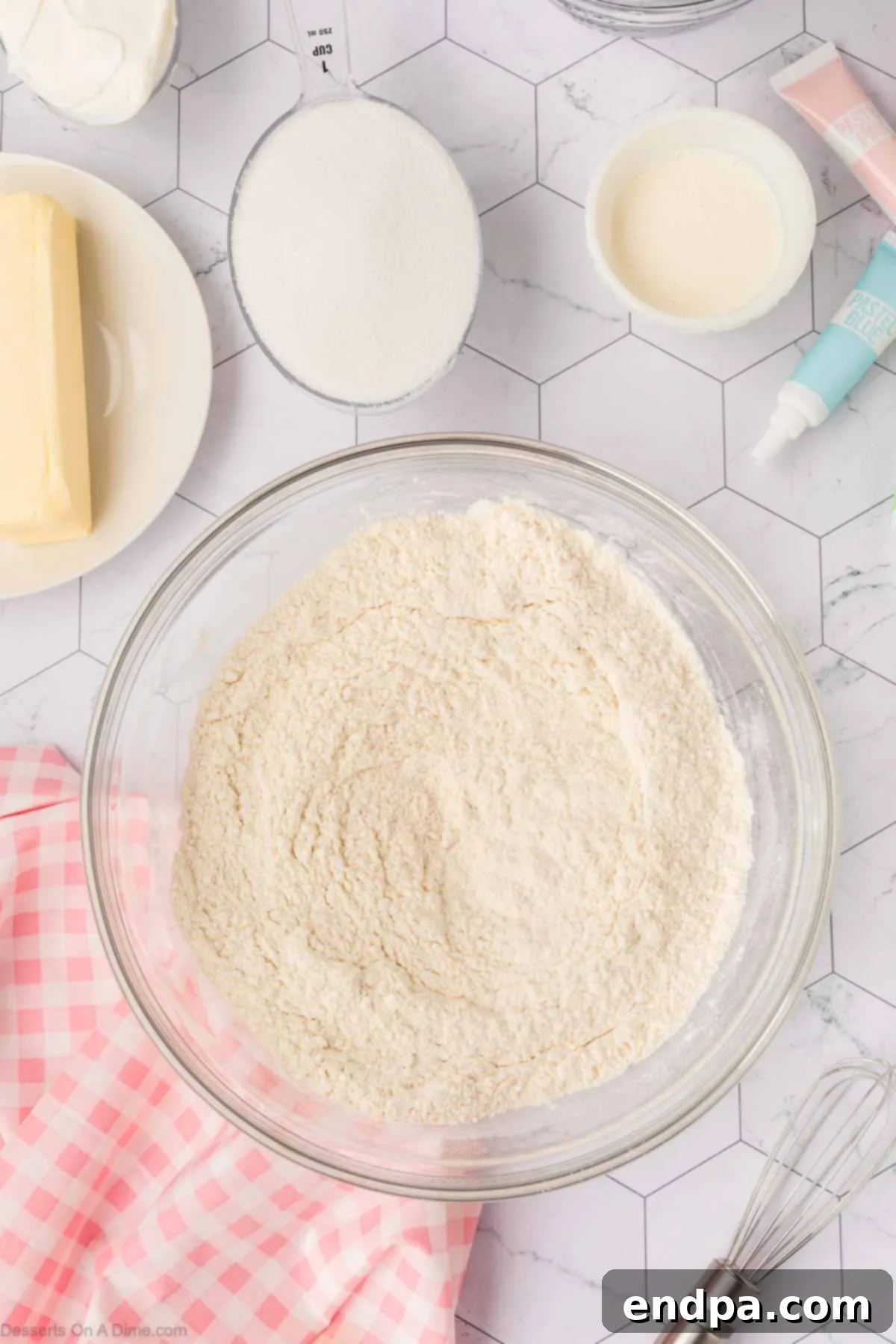 Cloud-Soft Sour Cream Cookies 3 Dry ingredients for cookies, including flour, baking powder, and salt, perfectly combined in a mixing bowl.