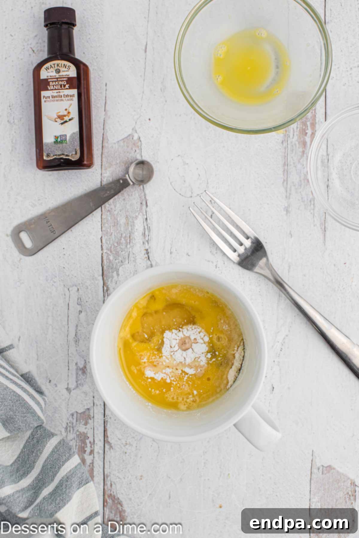 Vanilla Keto Mug Cake 2 Mug with all dry and wet ingredients added, before mixing.