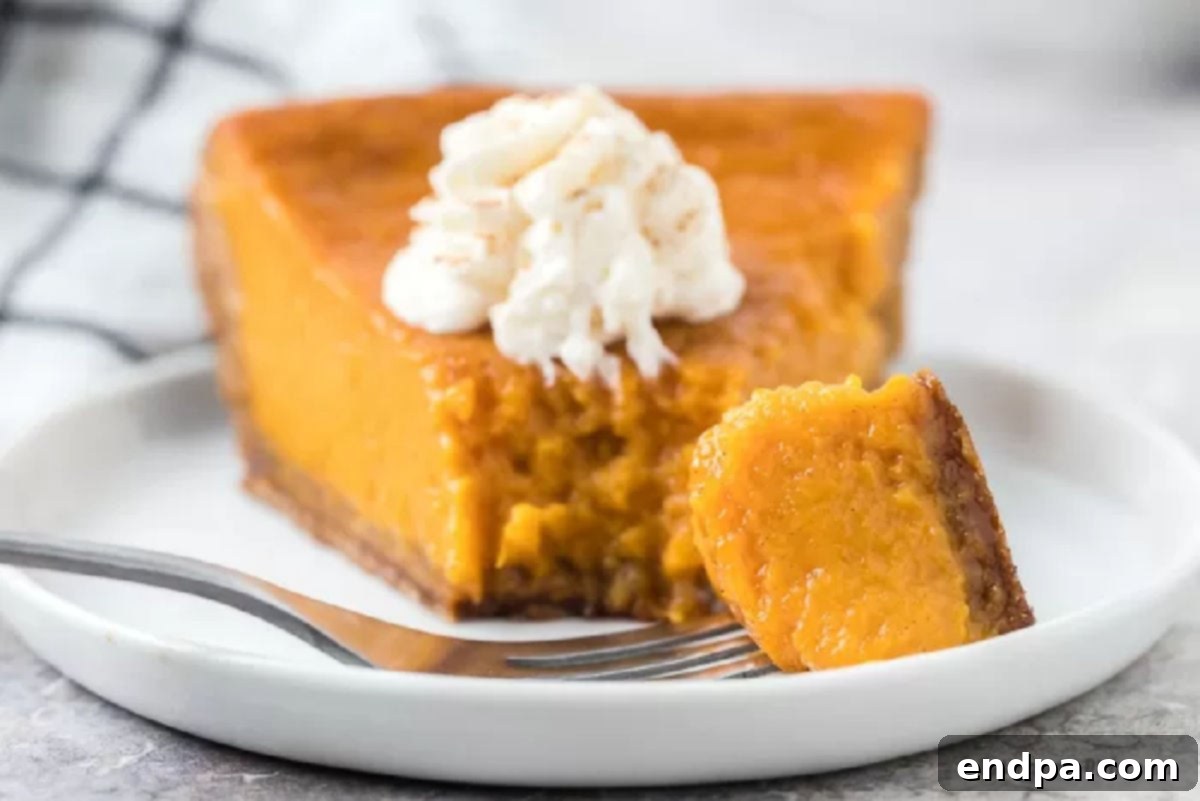 Slice of sweet potato pie on a white plate. 