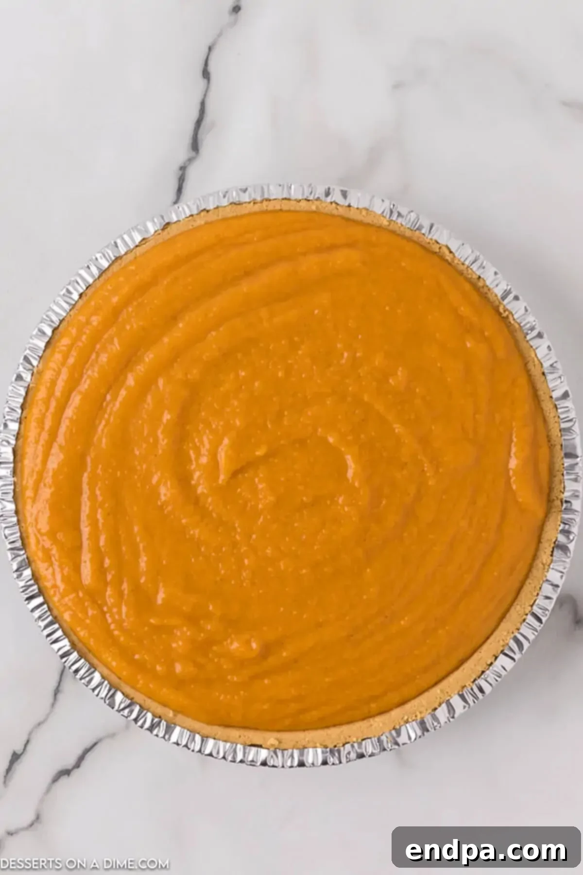 Pie filling poured into pie crust. 