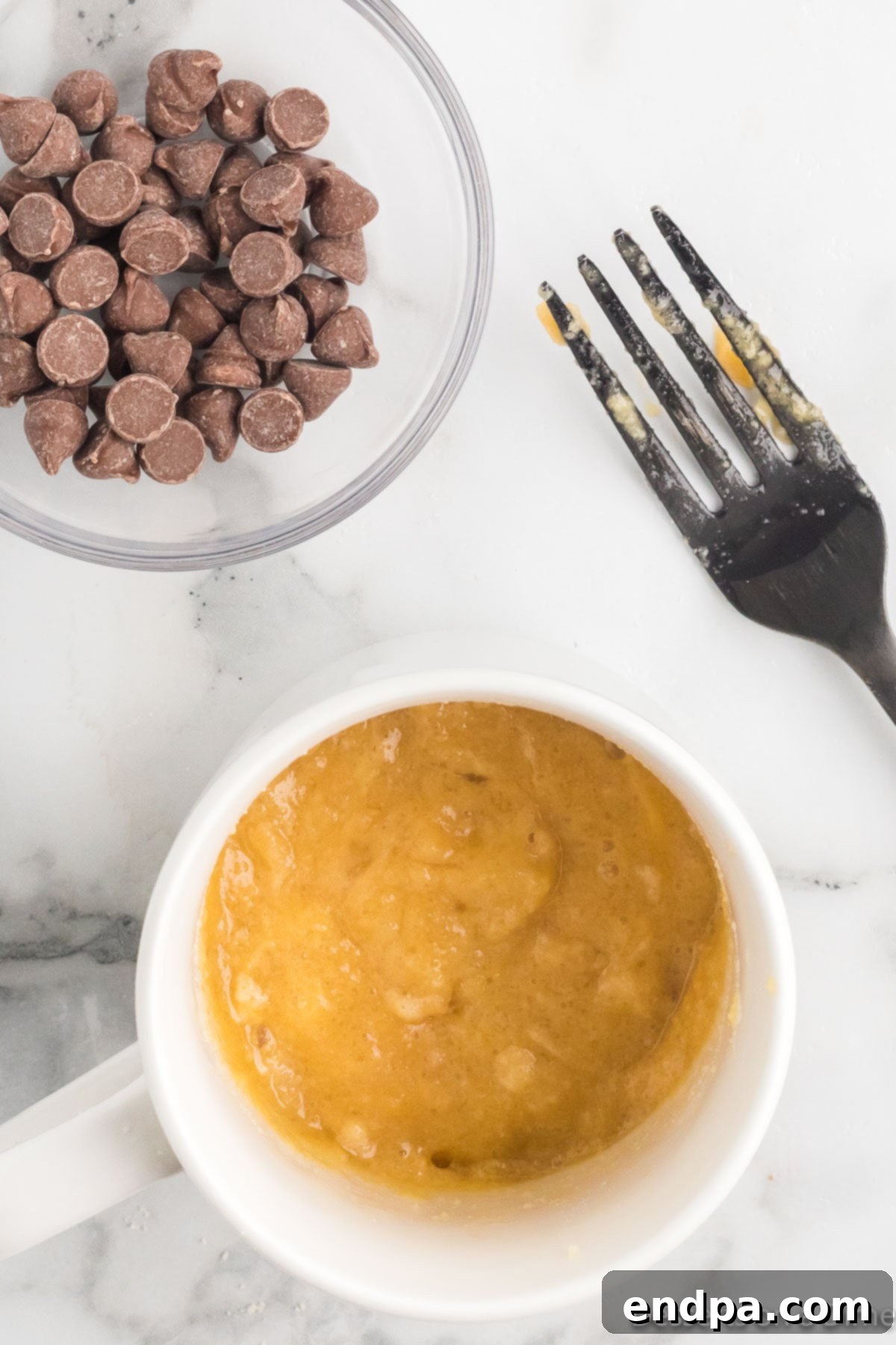 Heavenly Keto Chocolate Chip Mug Cake 5 Mug with cake mixture thoroughly combined.