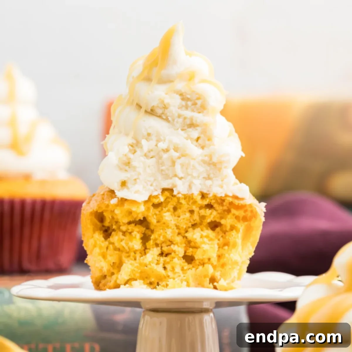 Delicious Harry Potter Butterbeer Cupcakes with generous frosting and drizzle.