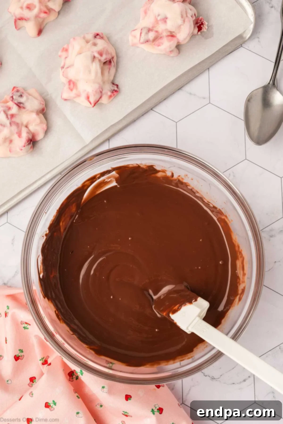 Smooth, melted chocolate mixture in a bowl, ready for dipping.