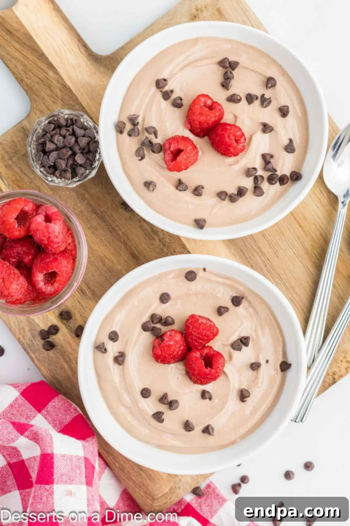 Wholesome Curd Delight 6 Close-up of bowls of creamy Cottage Cheese Pudding, beautifully adorned with vibrant fresh berries and fruit slices.