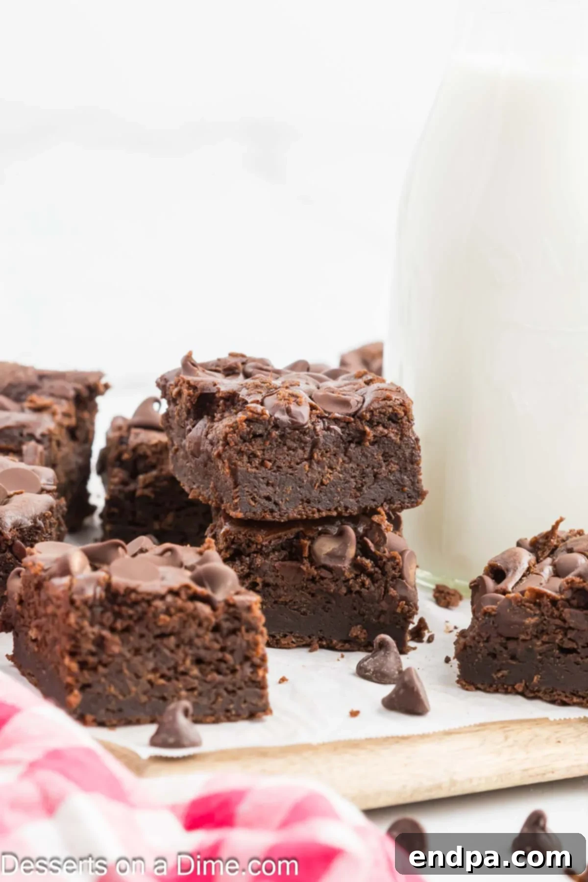 Decadent Cottage Cheese Swirl Brownies 2 Cottage Cheese Brownies stacked together, showing their rich, fudgy texture.