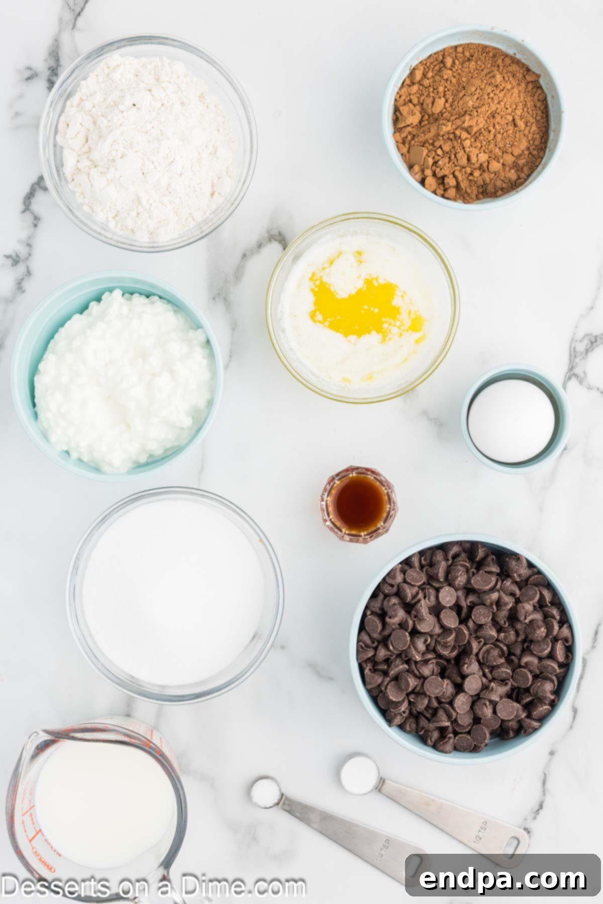 Decadent Cottage Cheese Swirl Brownies 3 Ingredients for Cottage Cheese Brownies, including cottage cheese, chocolate chips, vanilla, egg, butter, cocoa powder, flour, baking soda, and granulated sugar.