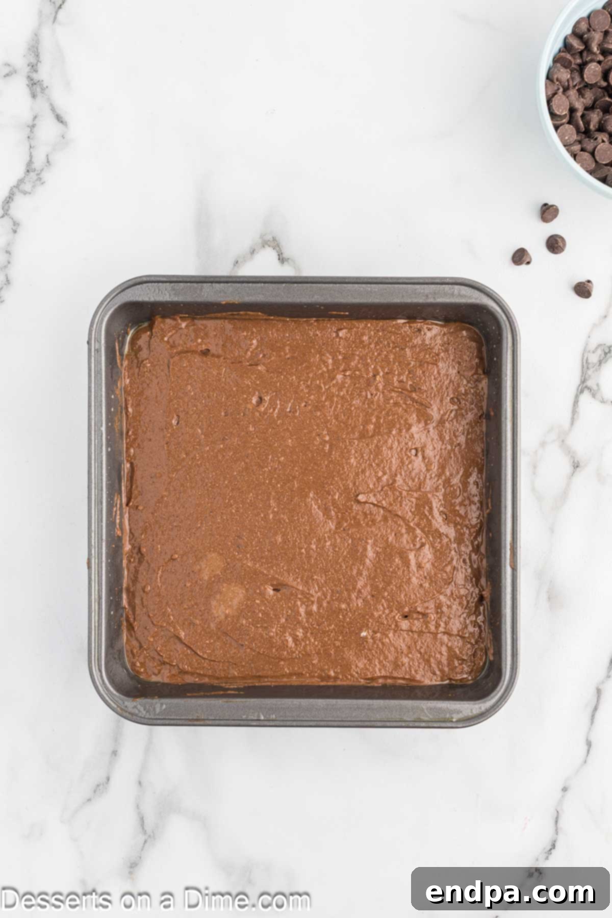 Decadent Cottage Cheese Swirl Brownies 6 Brownie batter spread evenly in a prepared baking dish.