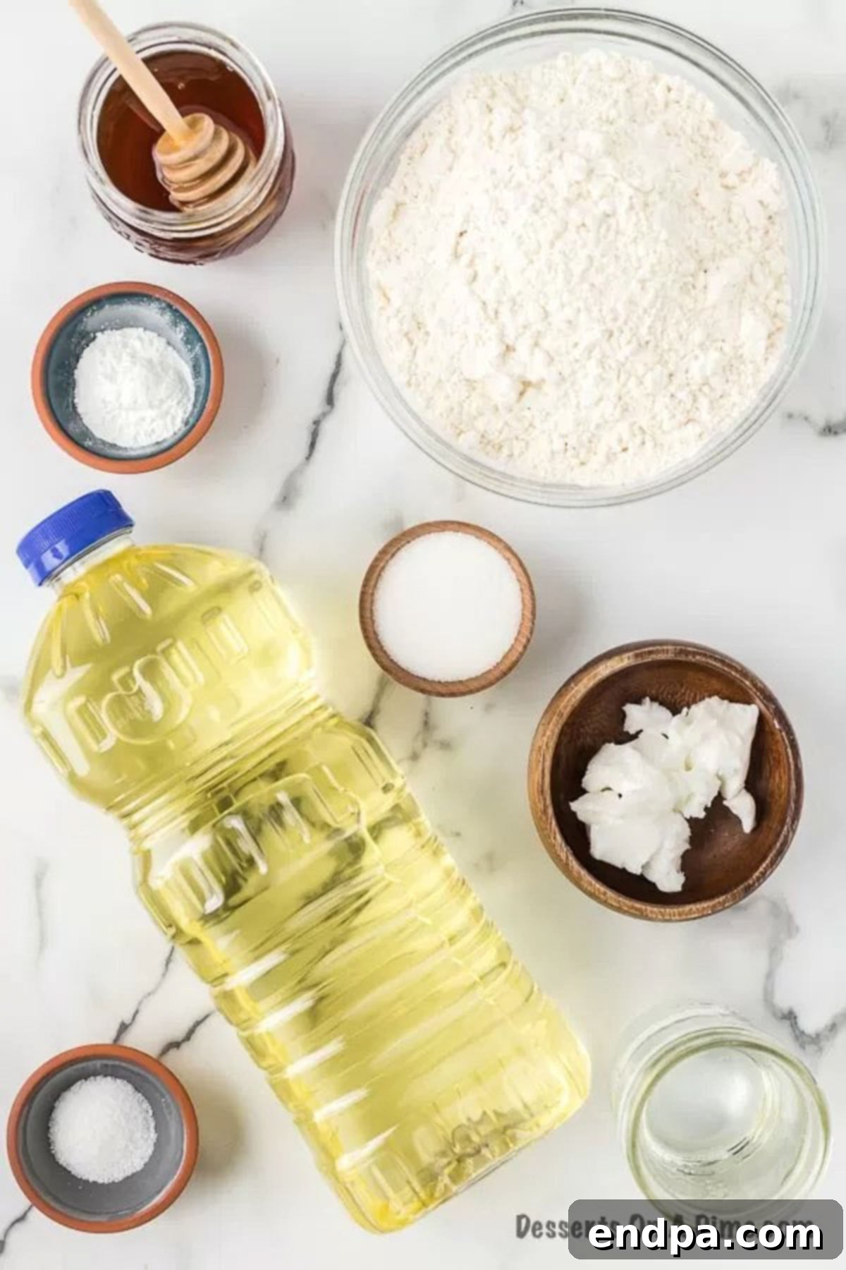 Ingredients for recipe: oil, flour, sugar, baking powder, salt, vegetable shortening, honey. 