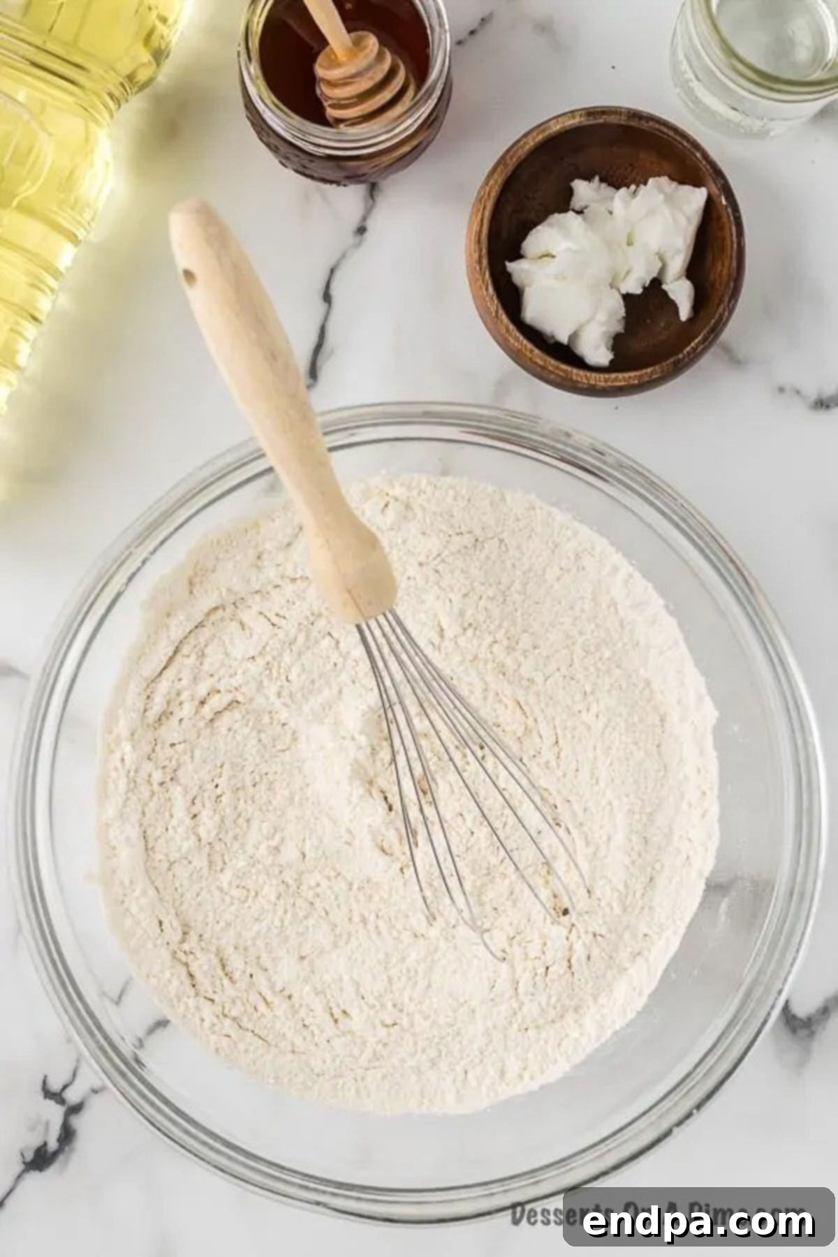 Mixing bowl with flour, salt and baking powder combined. 