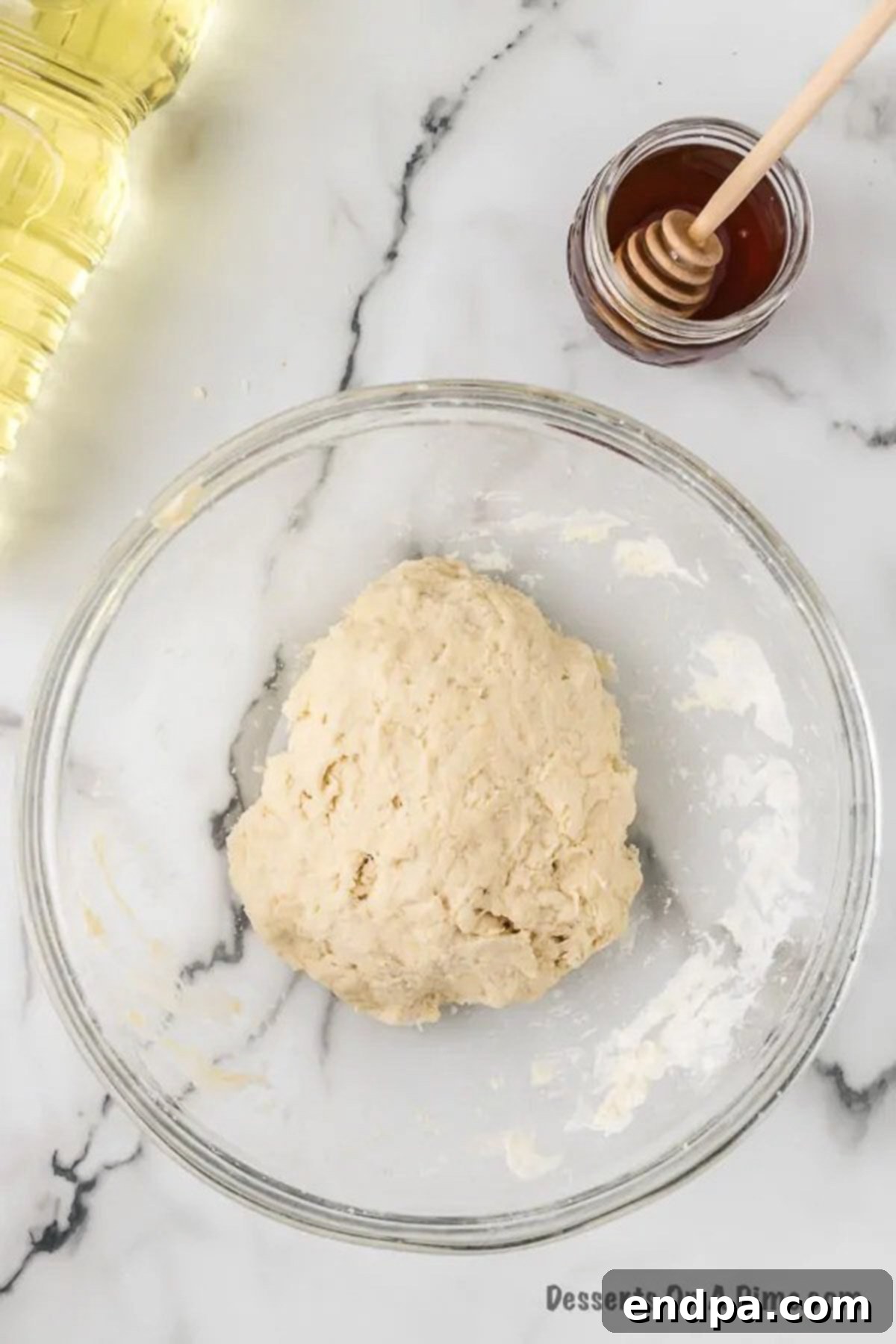 Dough combined together in a bowl. 