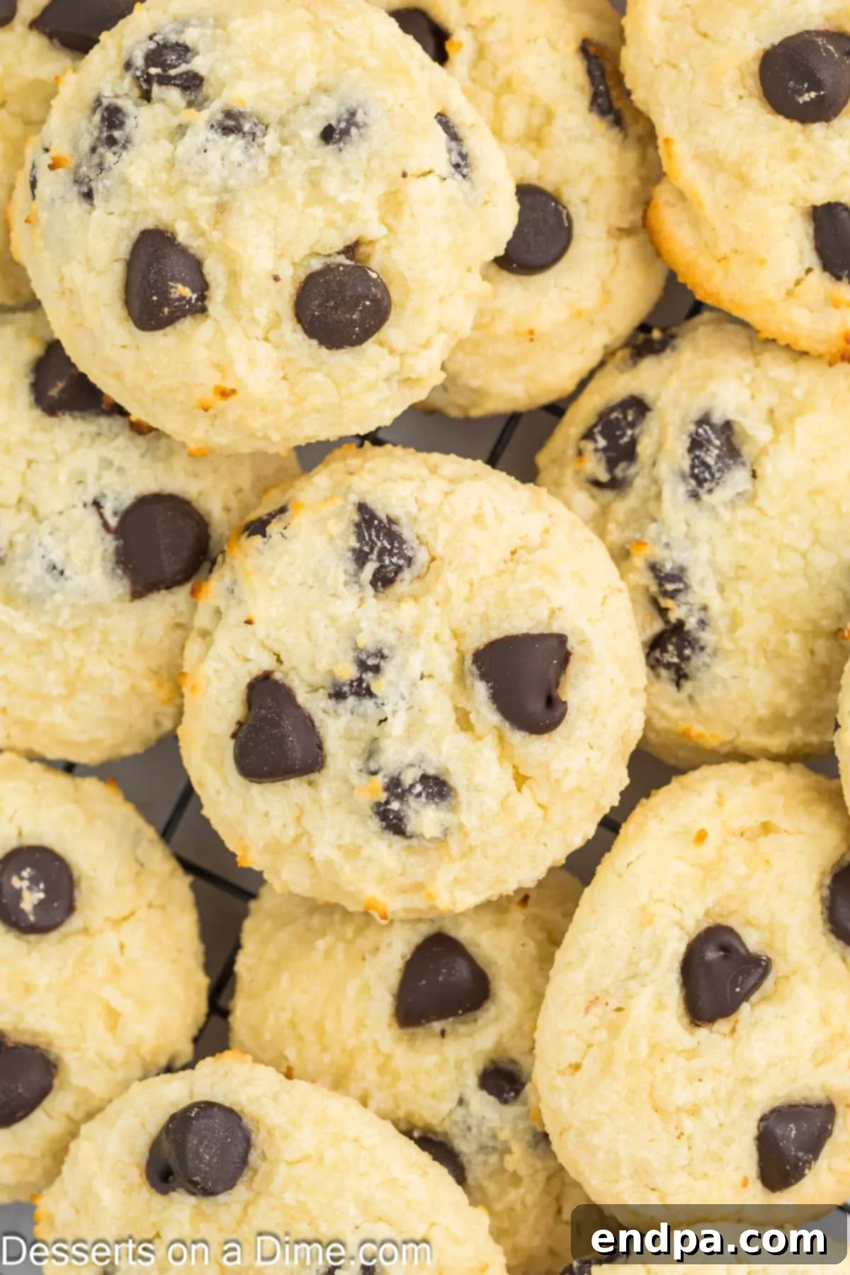 A pile of perfectly baked, high-protein cottage cheese chocolate chip cookies on a serving platter, ready to be enjoyed.