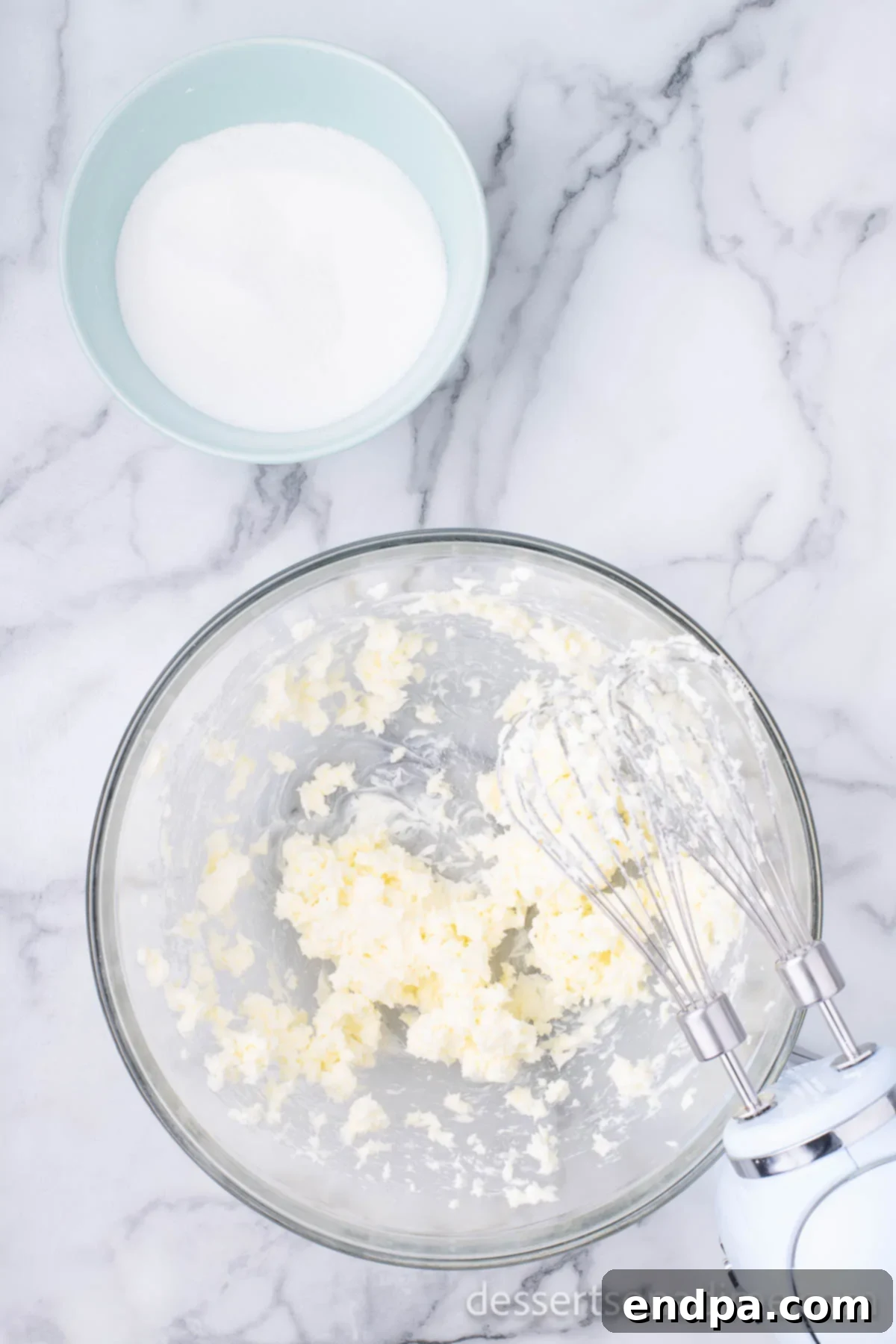 THUMBPRINT JAM COOKIES 4 Mixing bowl with softened butter and granulated sugar, ready for creaming.
