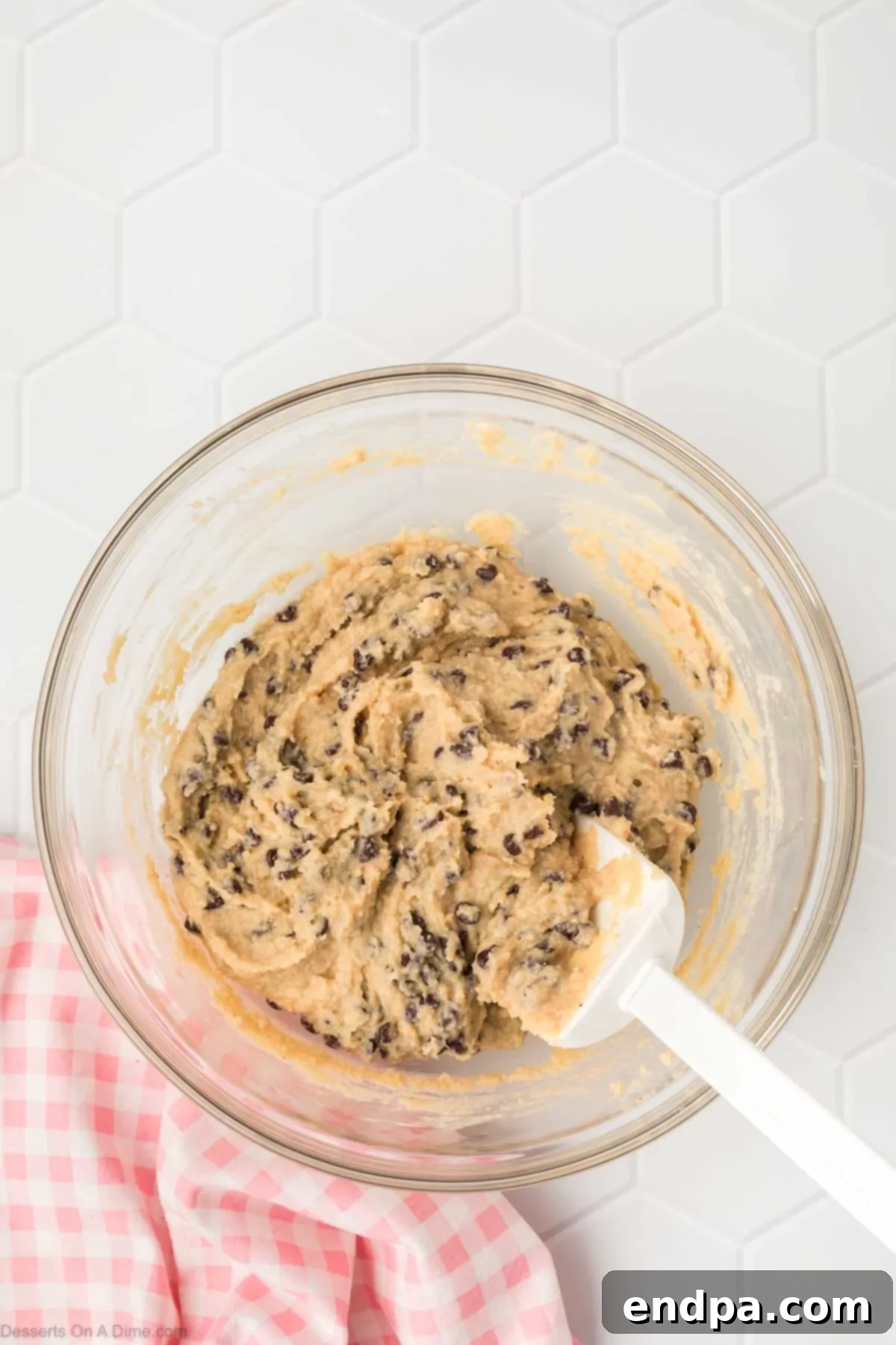 The finished cottage cheese cookie dough, with all the mini chocolate chips thoroughly mixed in, looking rich and ready to be served.