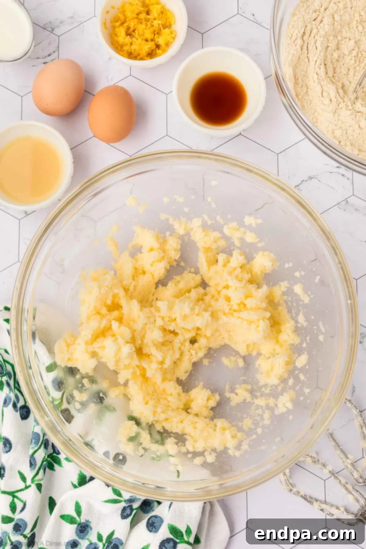 Creamed butter and granulated sugar, light and fluffy, in the bowl of a stand mixer, ready for the next step of the cookie dough.