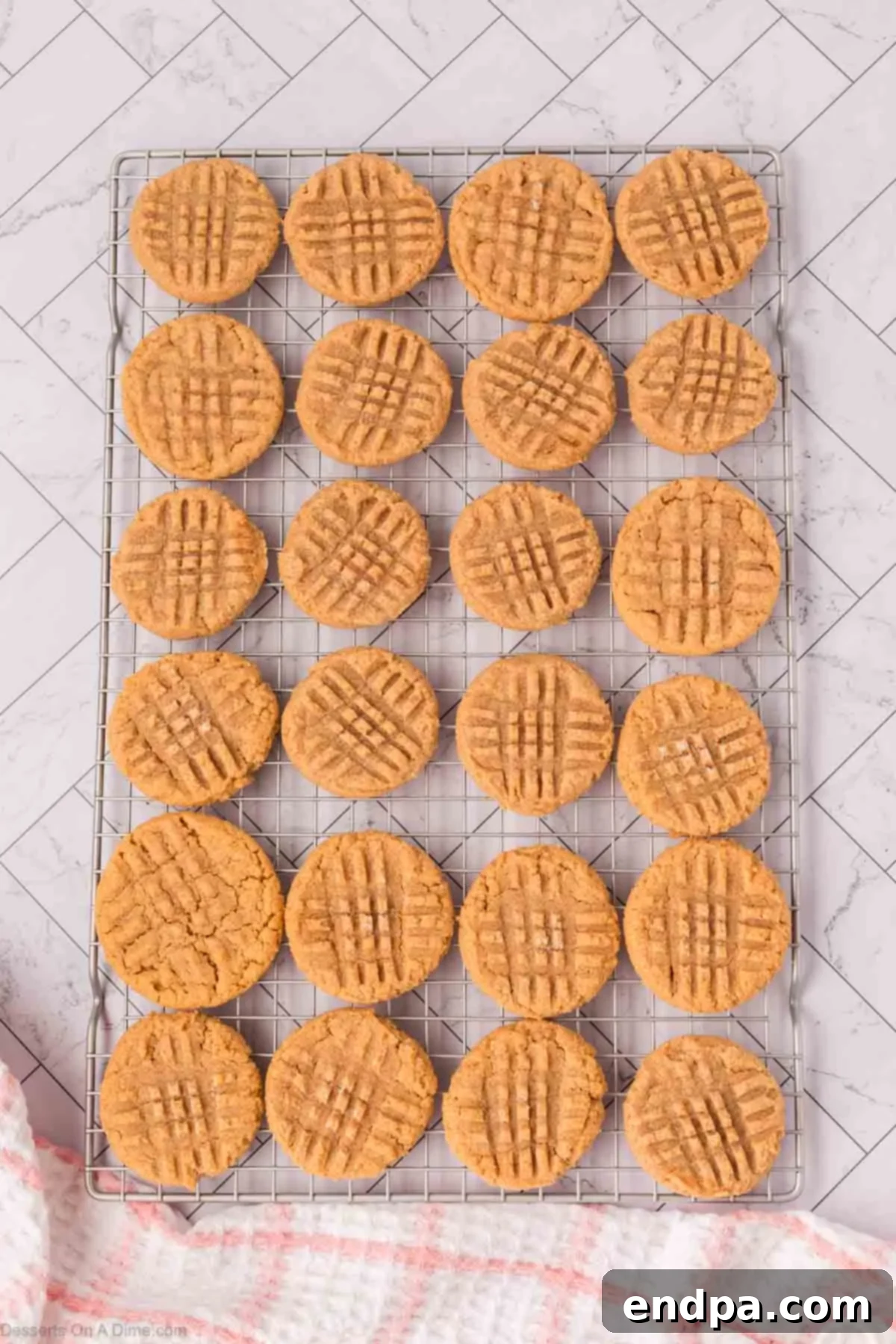 Freshly baked cookies cooling on a wire rack.