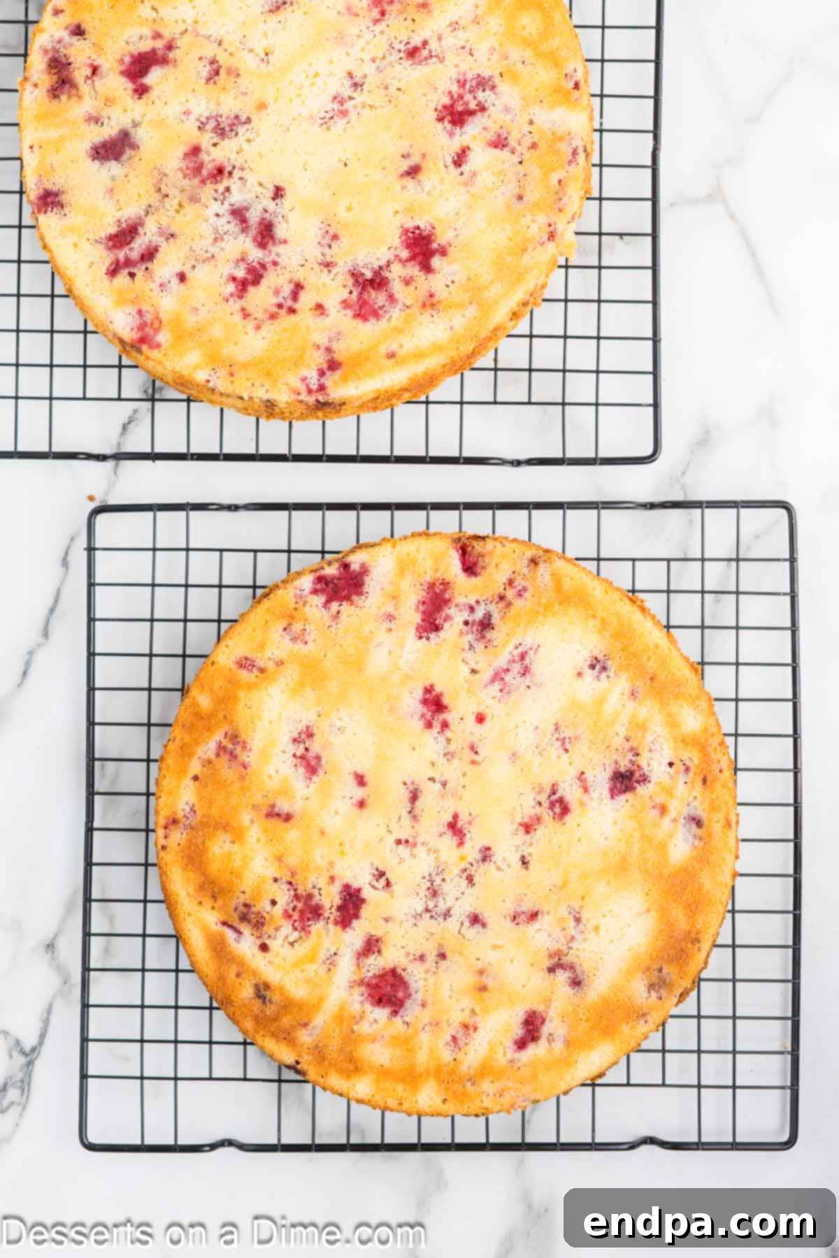 Lemon Berry Bliss 11 Baked cake layers cooling on wire racks after being removed from the pans.
