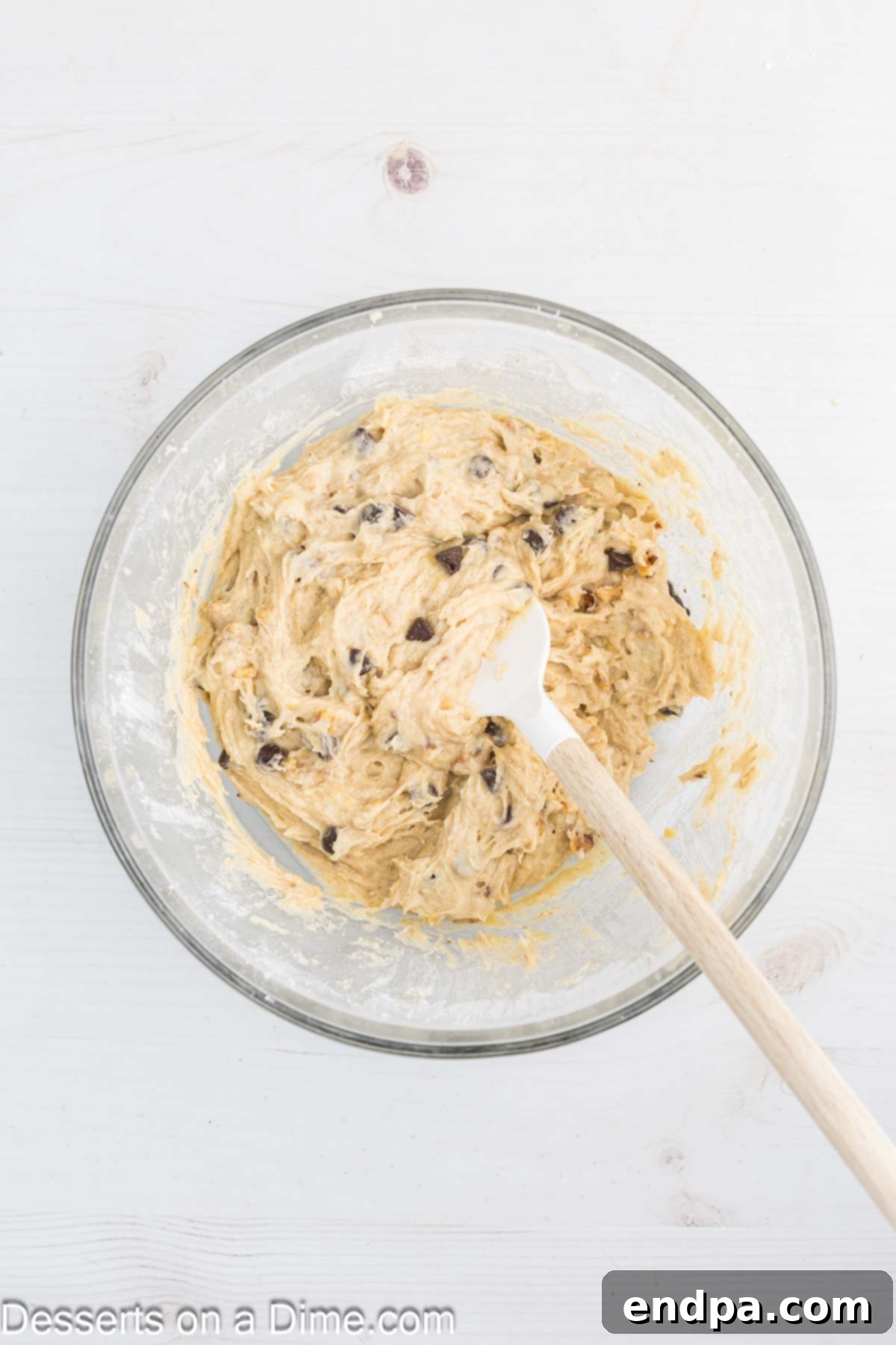 Chocolate chips and chopped nuts gently folded into the banana cookie dough with a spatula.