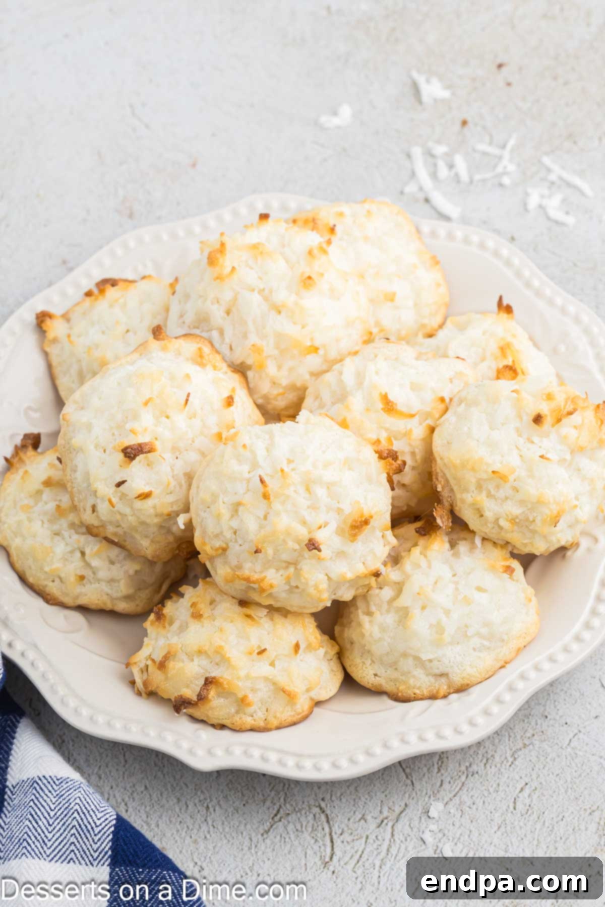A beautifully arranged platter of golden-brown Macaroon Cookies, highlighting their delicious texture.