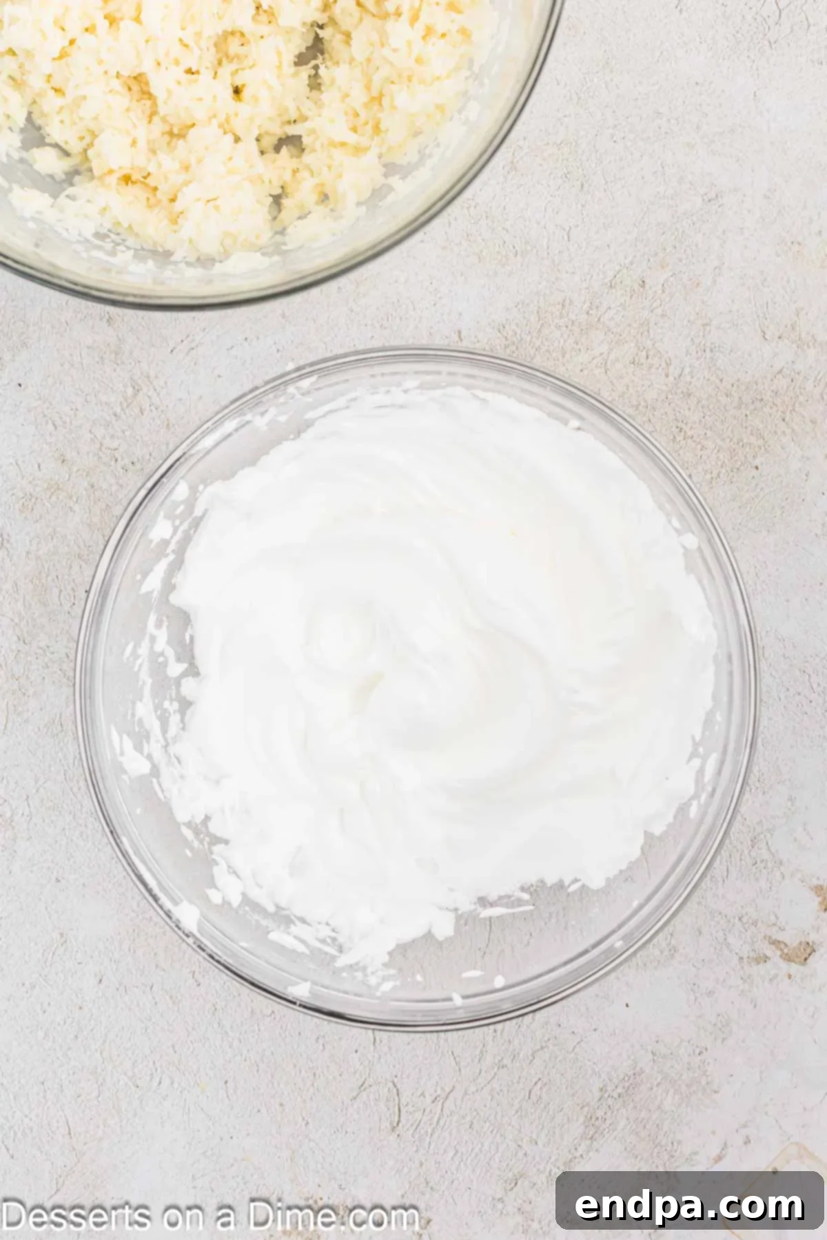 Egg whites beaten to soft peaks in a separate bowl using an electric mixer.