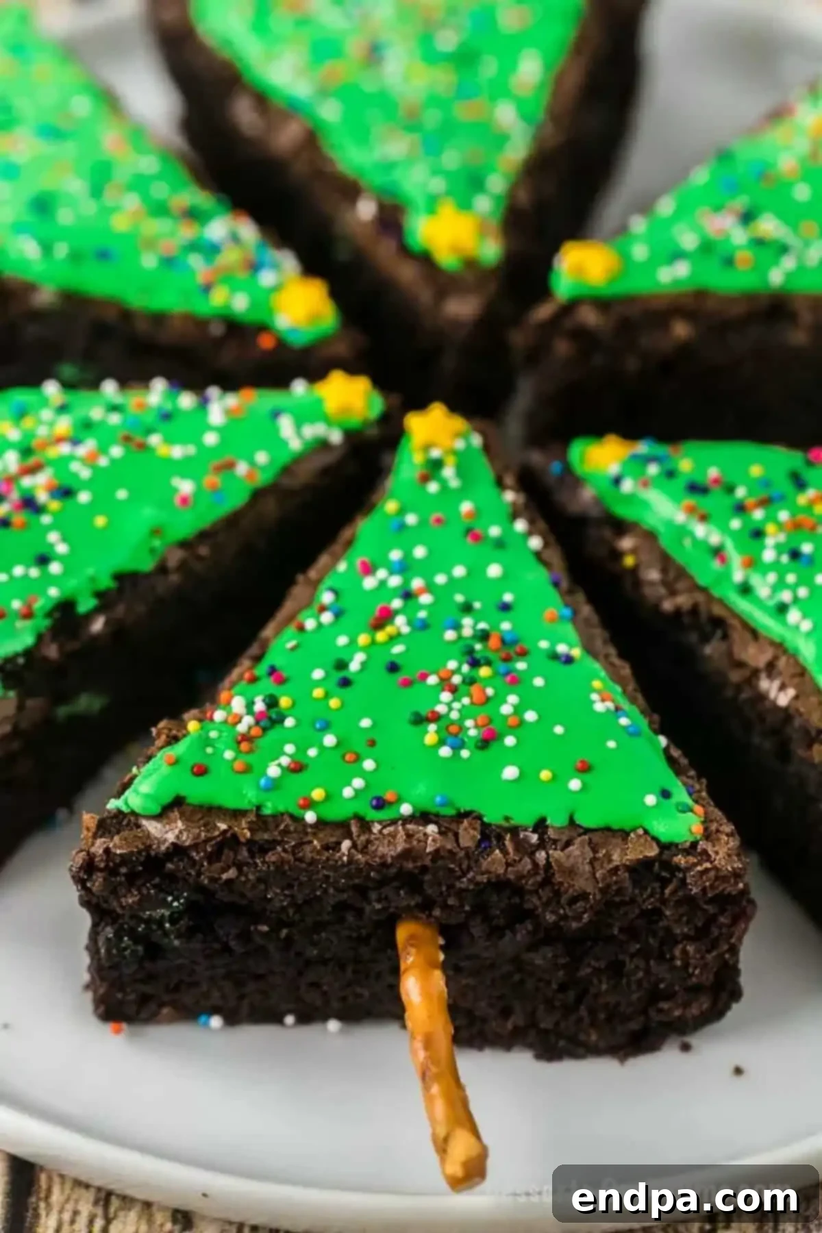 A festive platter filled with an array of Christmas tree brownies, showcasing their delightful holiday presentation.