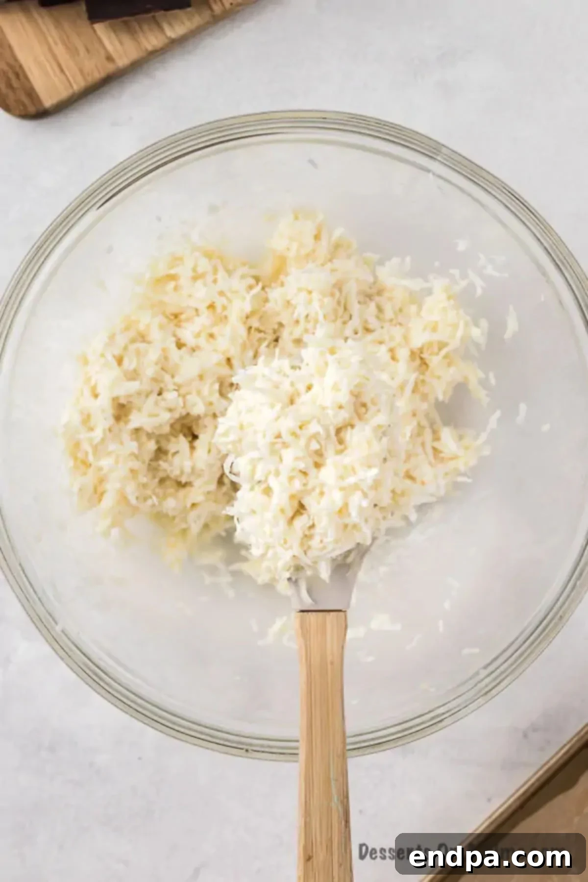 Decadent Homemade Mounds Bars 5 Coconut mixture thoroughly combined and ready for shaping.