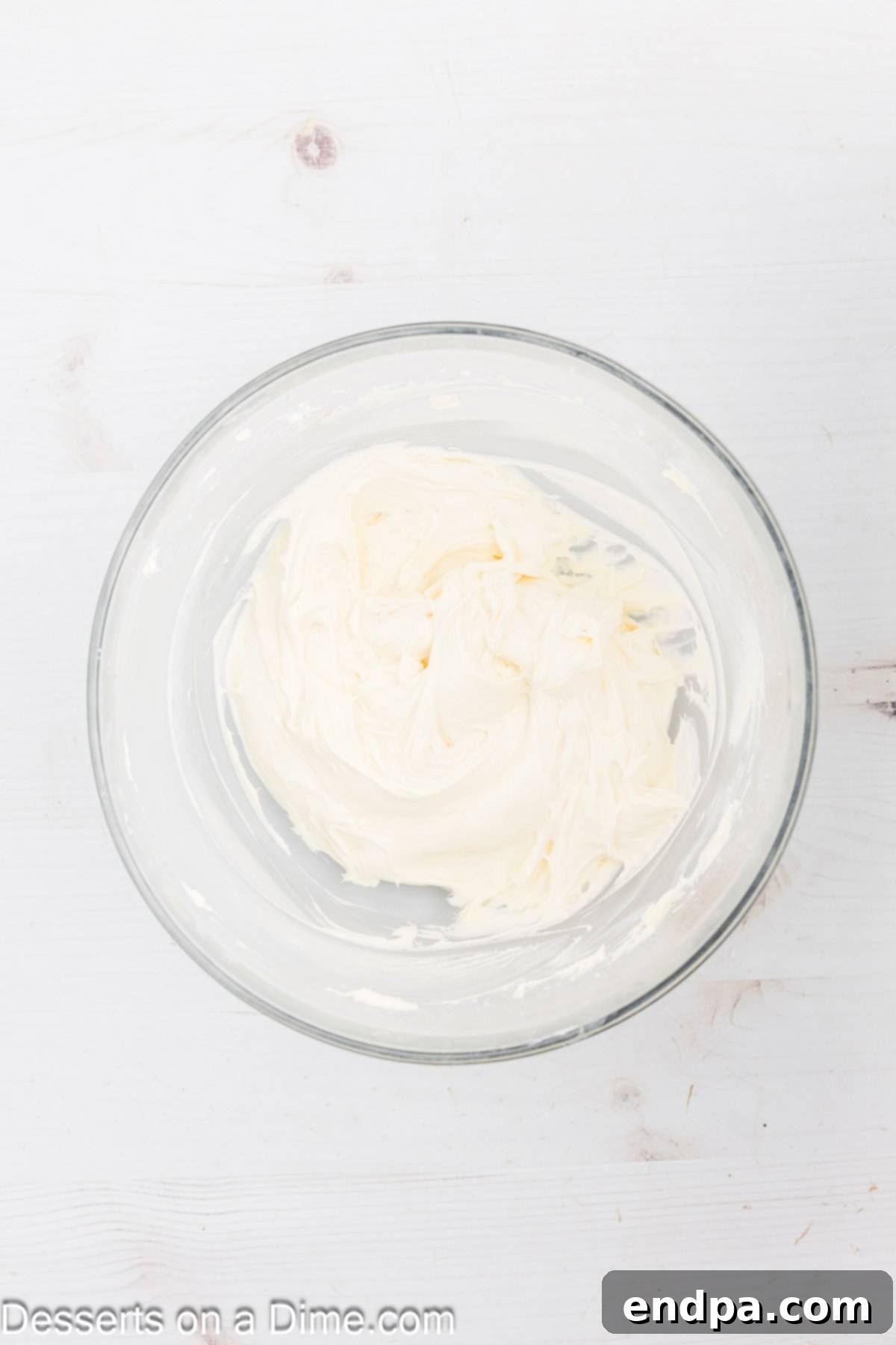 Fresh Fruit Fiesta Pizza 5 Cream cheese frosting ingredients (cream cheese, butter, powdered sugar, vanilla) mixed together in a large bowl, light and fluffy.