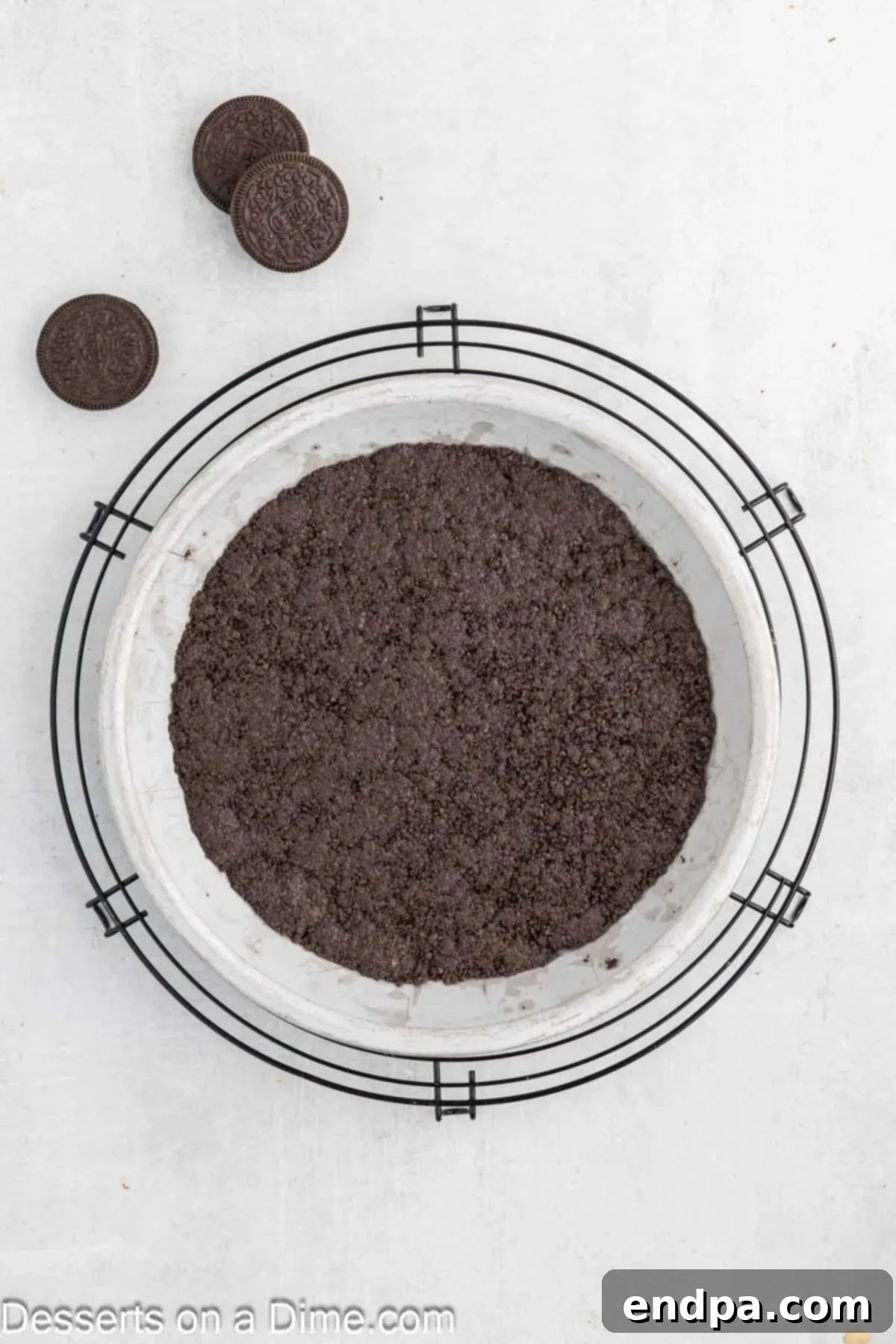 Hula Pie 5 The chocolate cookie crust evenly pressed into a pie dish, ready for baking.