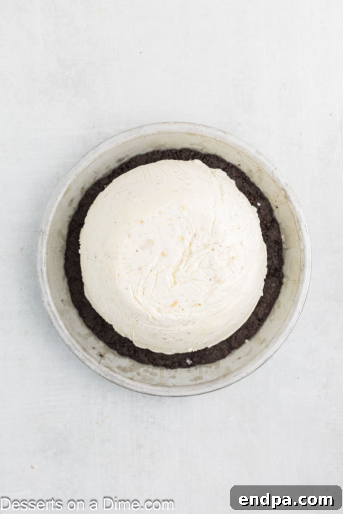 Hula Pie 8 The frozen ice cream dome carefully placed into the cooled chocolate cookie pie crust.